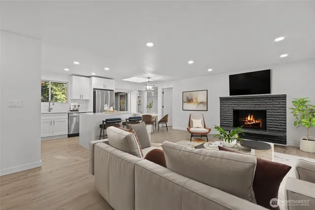 a living room with fireplace furniture and a flat screen tv
