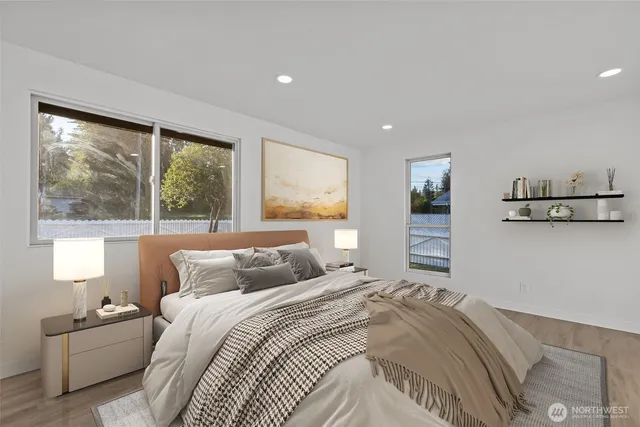 a bedroom with a large bed and a window