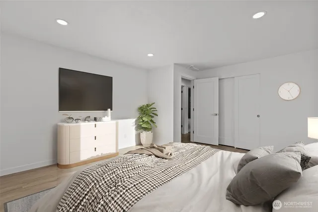 a bedroom with bed and tv