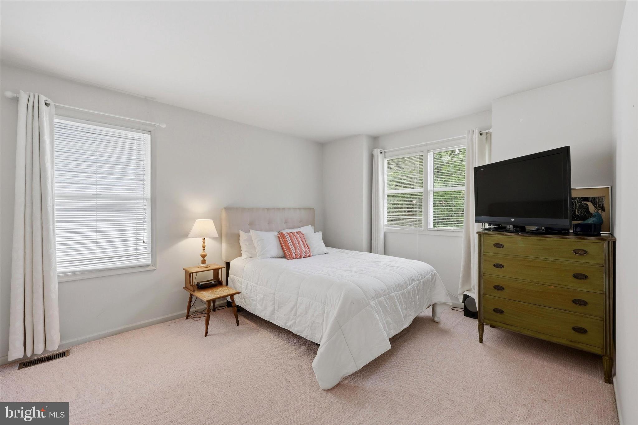 320 Maple Avenue Wyncote, PA 19095 - Photo 18 of 28 a bedroom with a bed and a flat tv screen on dresser