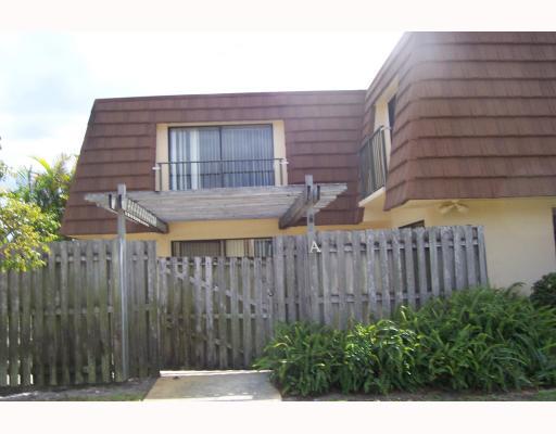 2675 Albatross Road North, Unit A Delray Beach, FL 33444 - Photo 1 of 1 a view of a house with a backyard and wooden fence