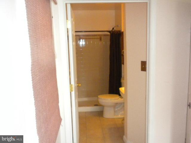 604 Cannon Road Silver Spring, MD 20904 - Photo 4 of 11 a bathroom with a toilet and a shower