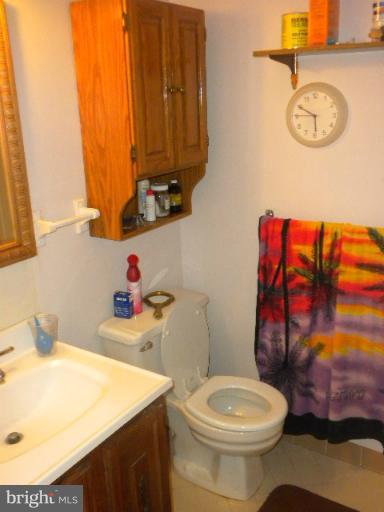 604 Cannon Road Silver Spring, MD 20904 - Photo 8 of 11 a bathroom with a sink and a toilet