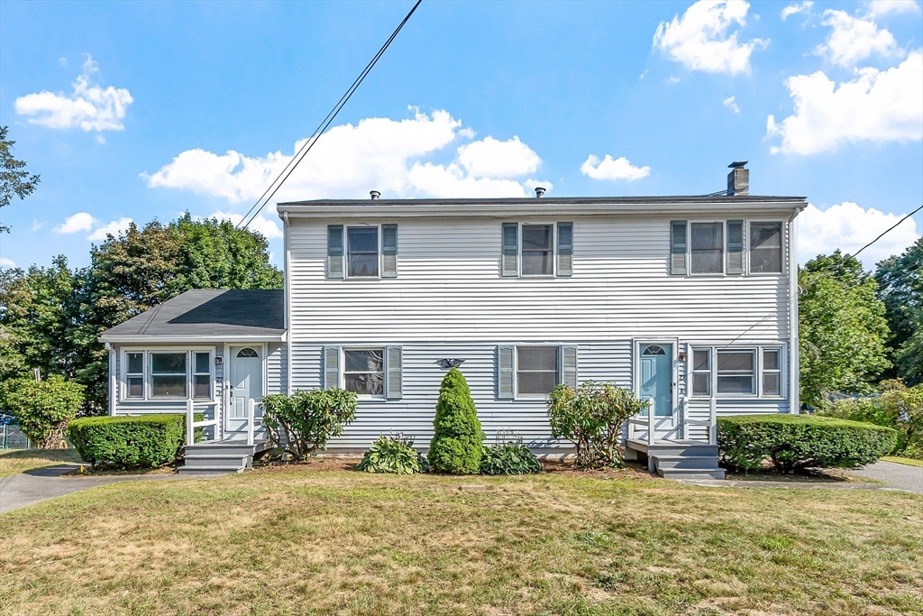 a front view of a house with a yard