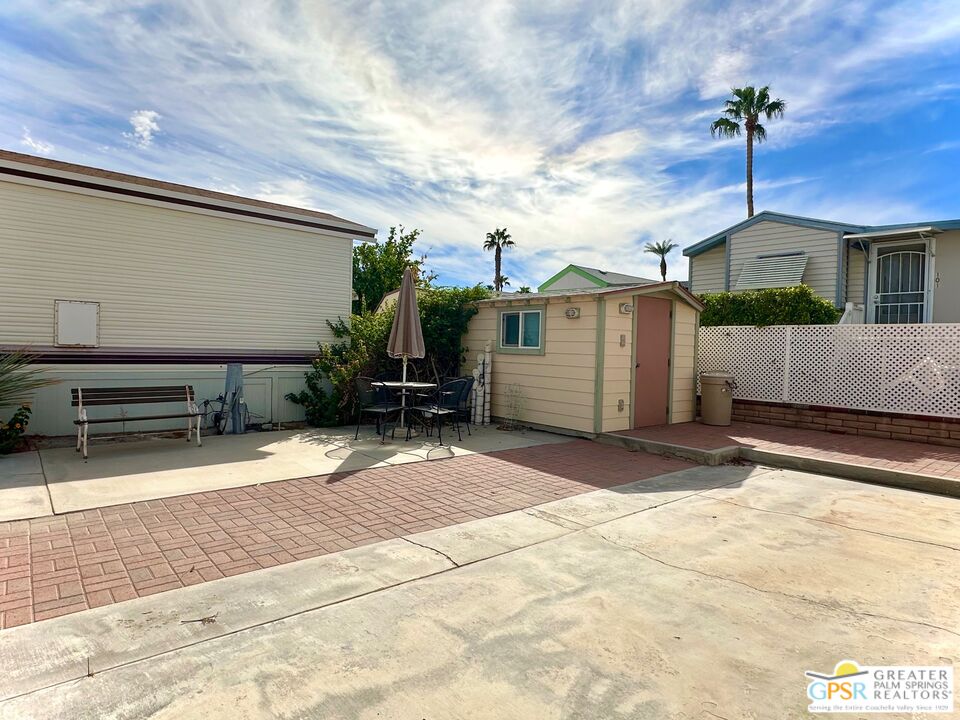 69801 Ramon Road, Unit 85 Cathedral City, CA 92234 - Photo 2 of 2 a view of a house with a yard