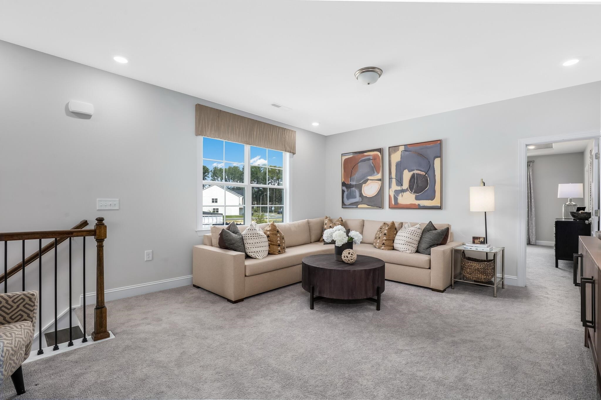 116 Canyon Gap Way, Unit 177 Raleigh, NC 27610 - Photo 22 of 38 a living room with furniture and a window