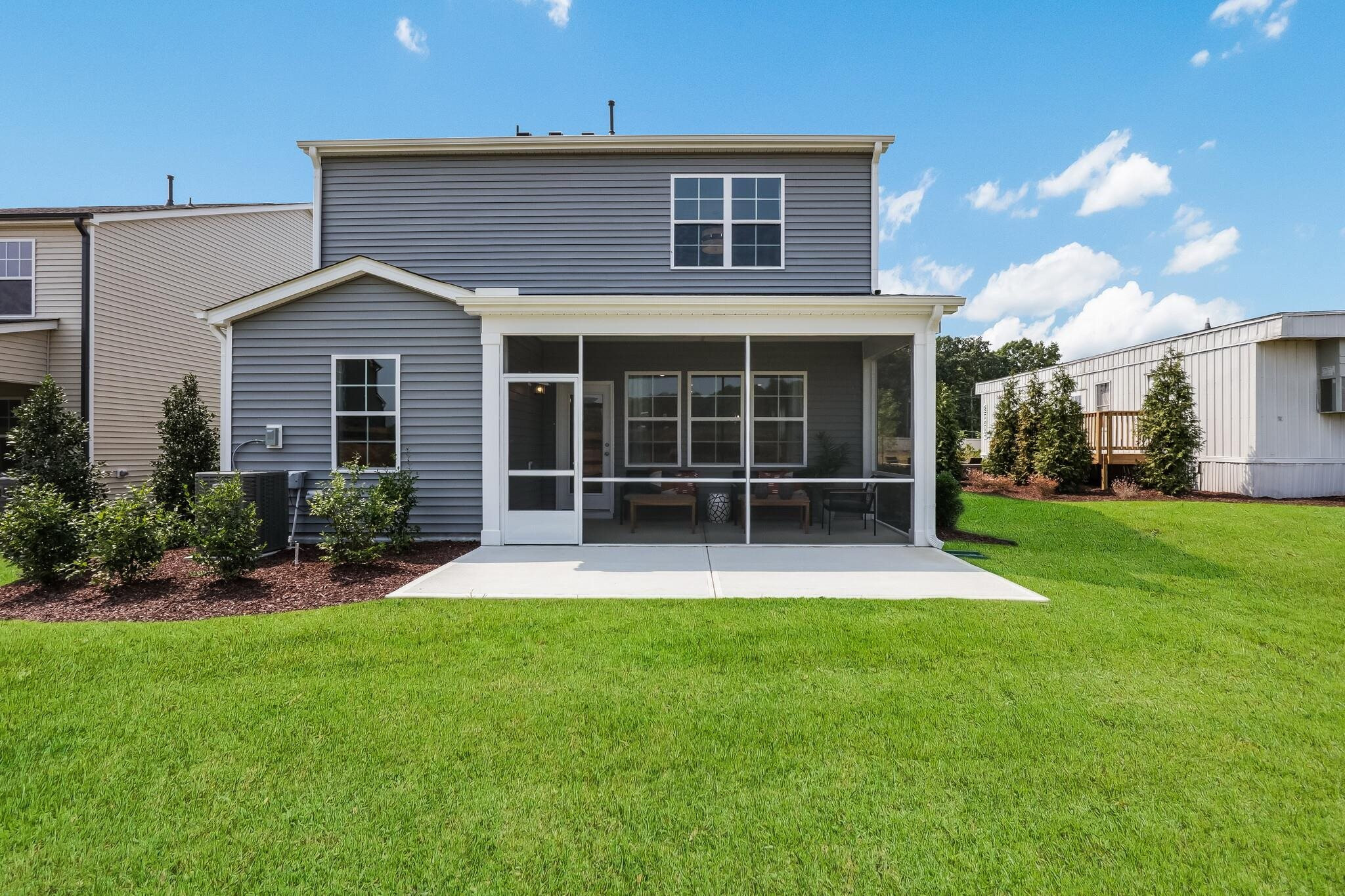 116 Canyon Gap Way, Unit 177 Raleigh, NC 27610 - Photo 38 of 38 a view of white house with a yard and plants