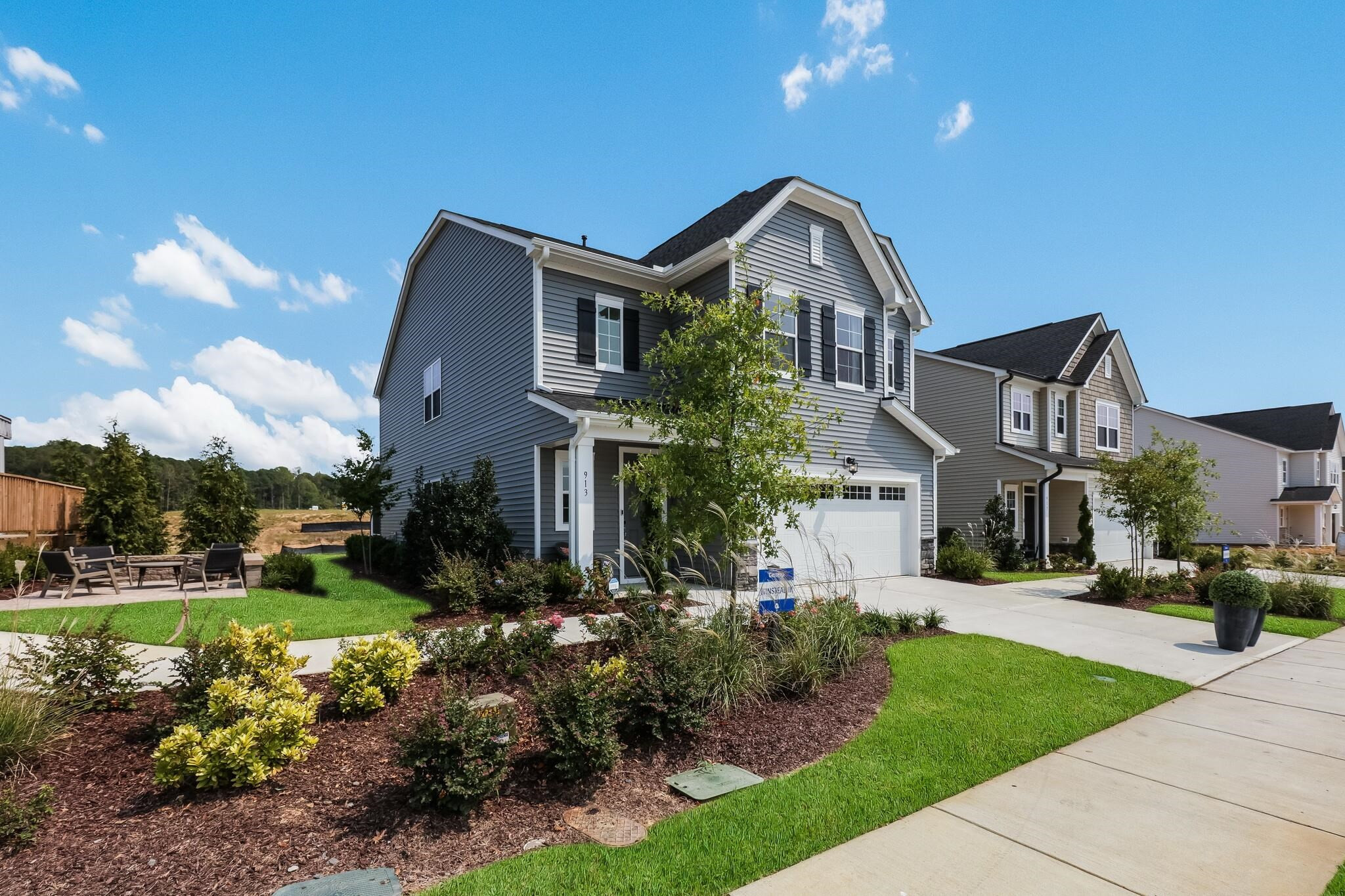 116 Canyon Gap Way, Unit 177 Raleigh, NC 27610 - Photo 5 of 38 a front view of a house with a yard