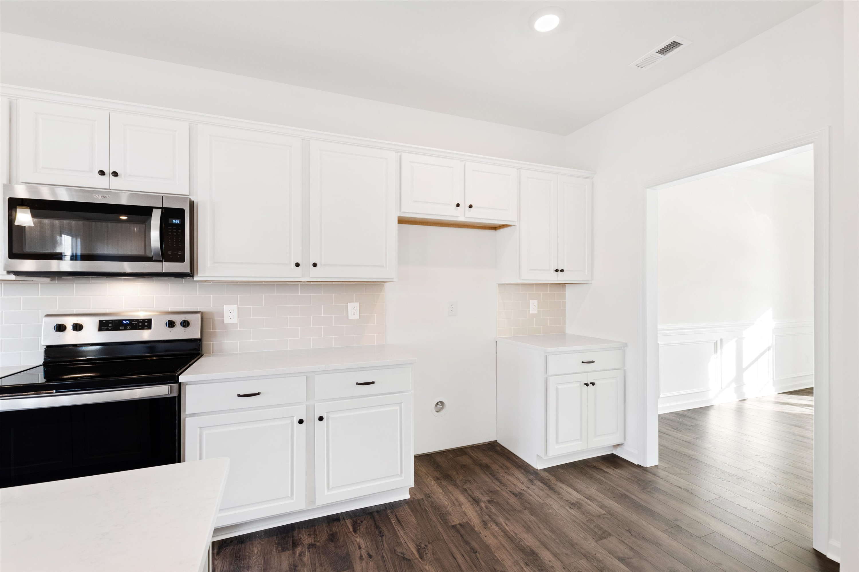 45 Cutshaw Road Youngsville, NC 27596 - Photo 14 of 49 a kitchen with granite countertop a stove a sink and a microwave