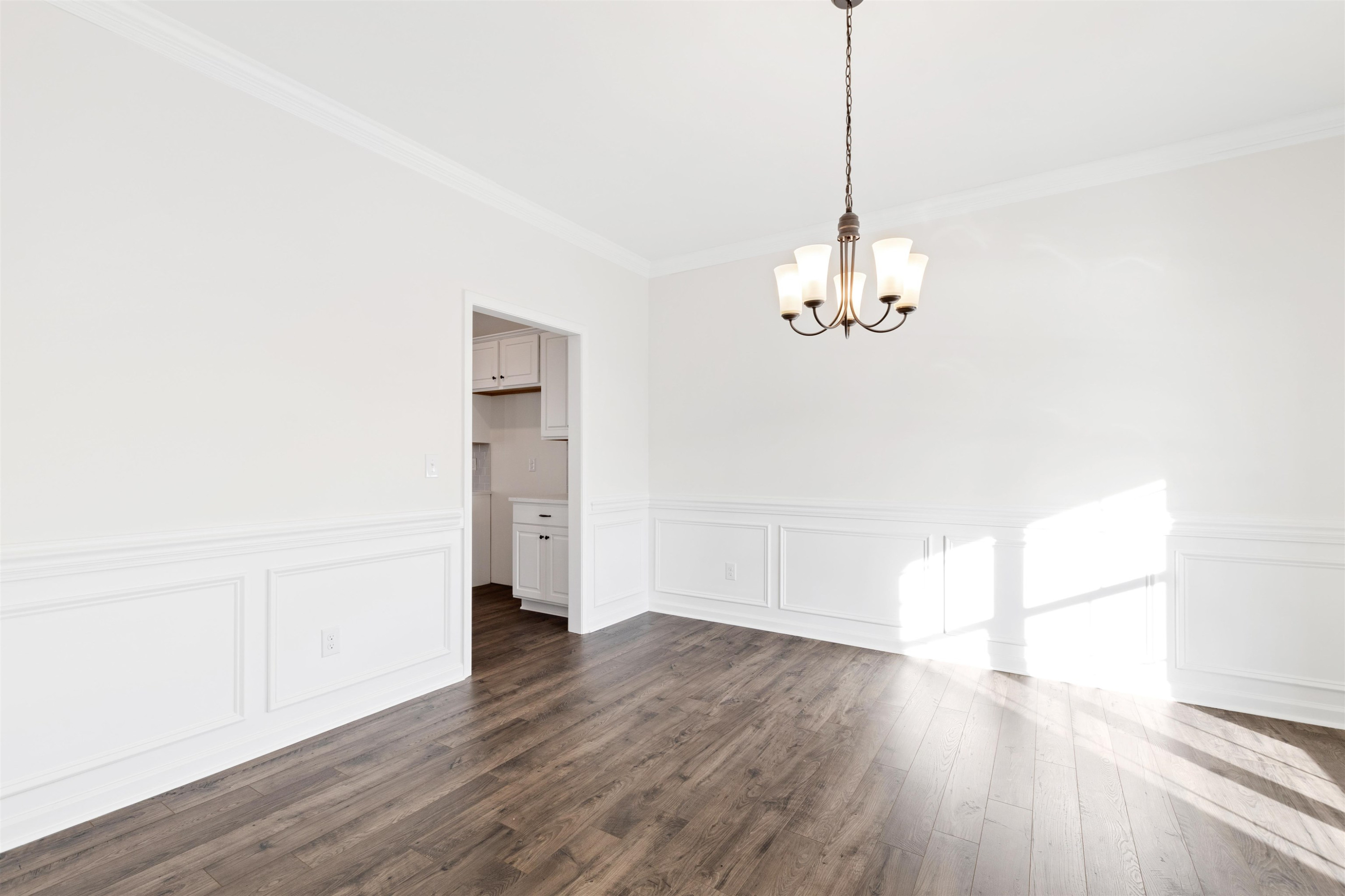 45 Cutshaw Road Youngsville, NC 27596 - Photo 17 of 49 a view of a room with wooden floor and chandelier