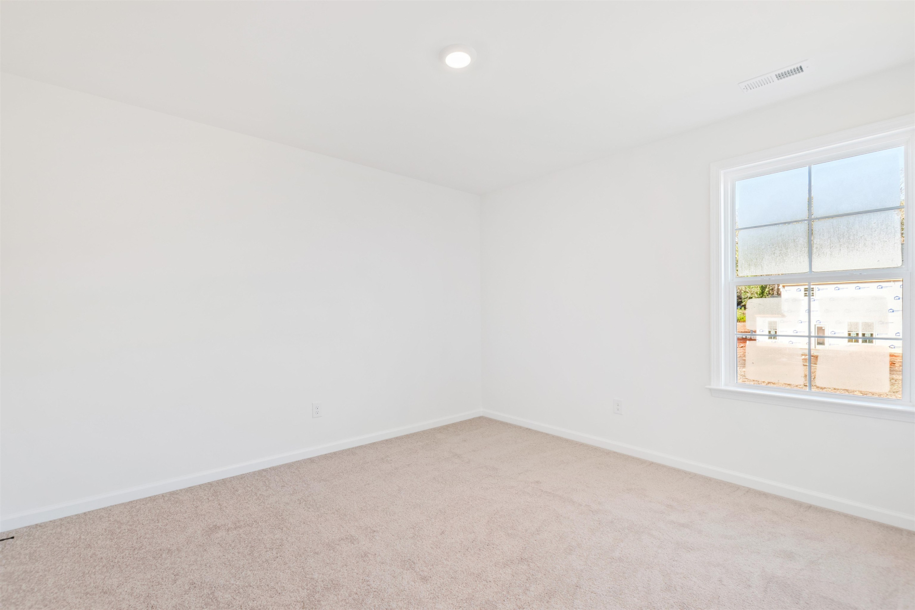 45 Cutshaw Road Youngsville, NC 27596 - Photo 24 of 49 an empty room with a window