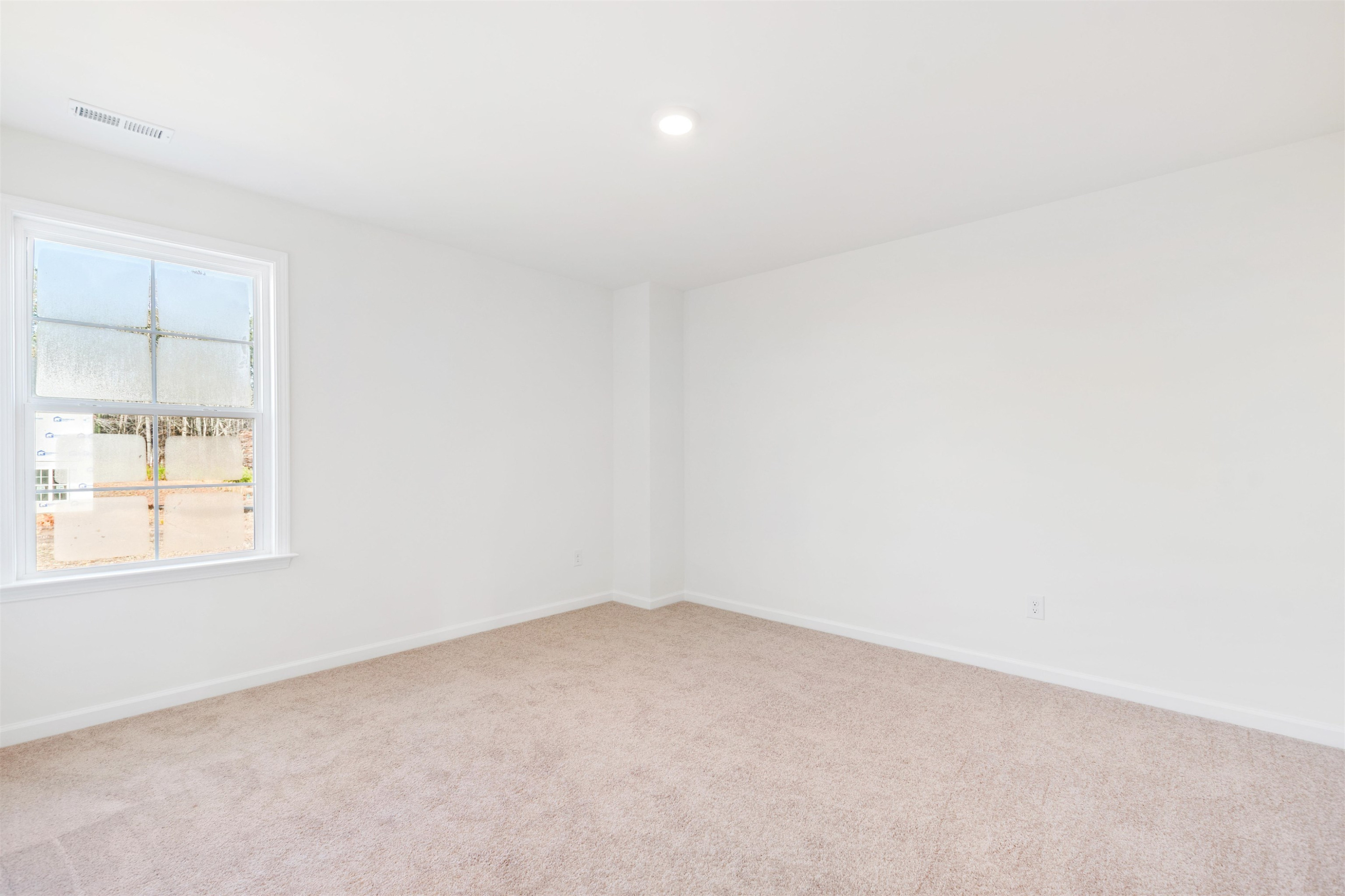 45 Cutshaw Road Youngsville, NC 27596 - Photo 25 of 49 an empty room with a window
