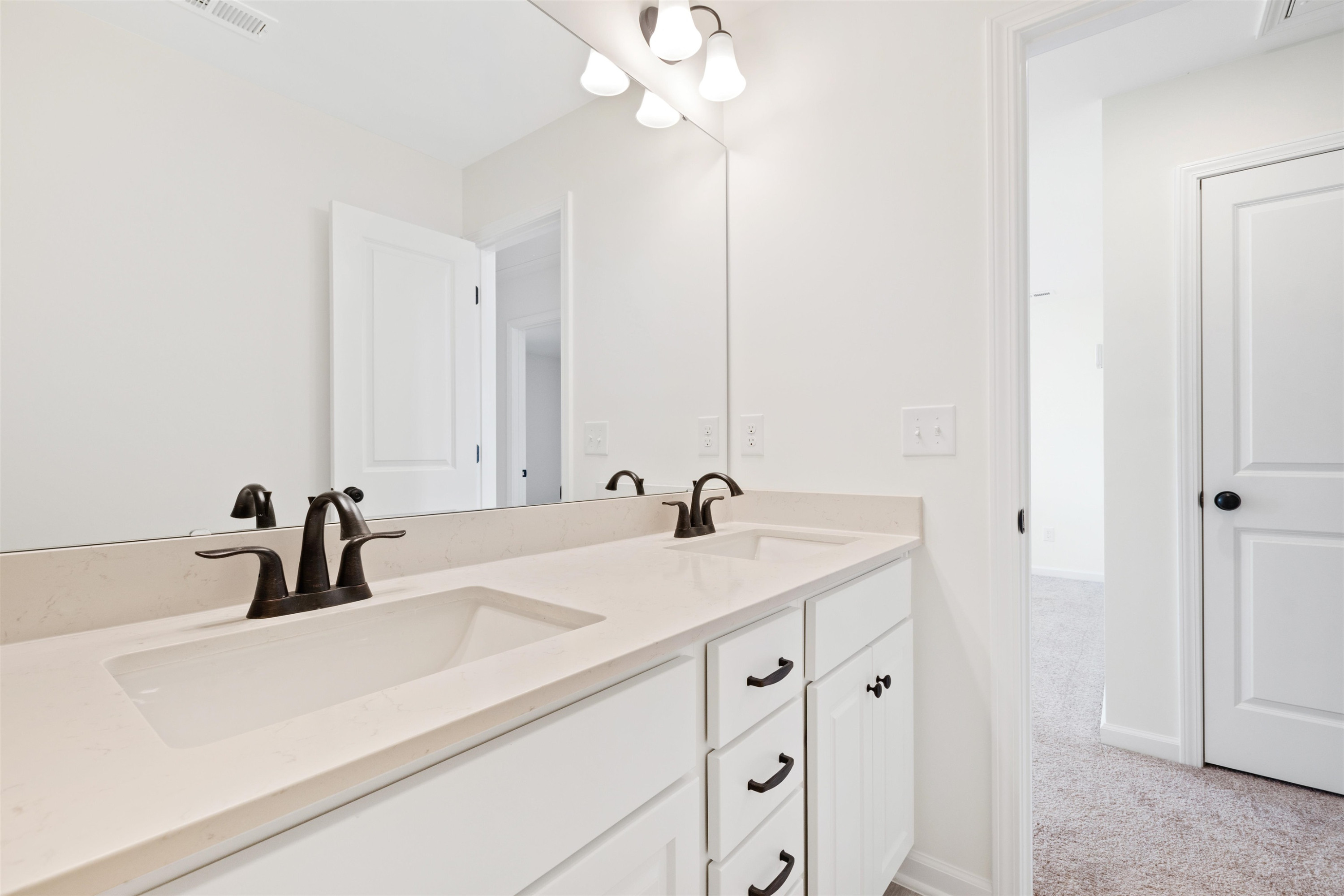 45 Cutshaw Road Youngsville, NC 27596 - Photo 33 of 49 a bathroom with a sink and a mirror