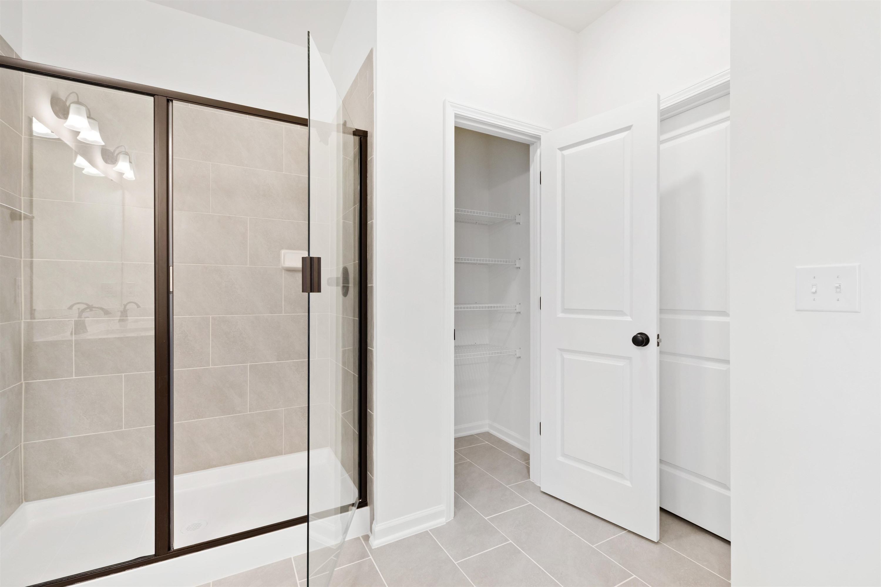 45 Cutshaw Road Youngsville, NC 27596 - Photo 36 of 49 a bathroom with a shower and a glass door