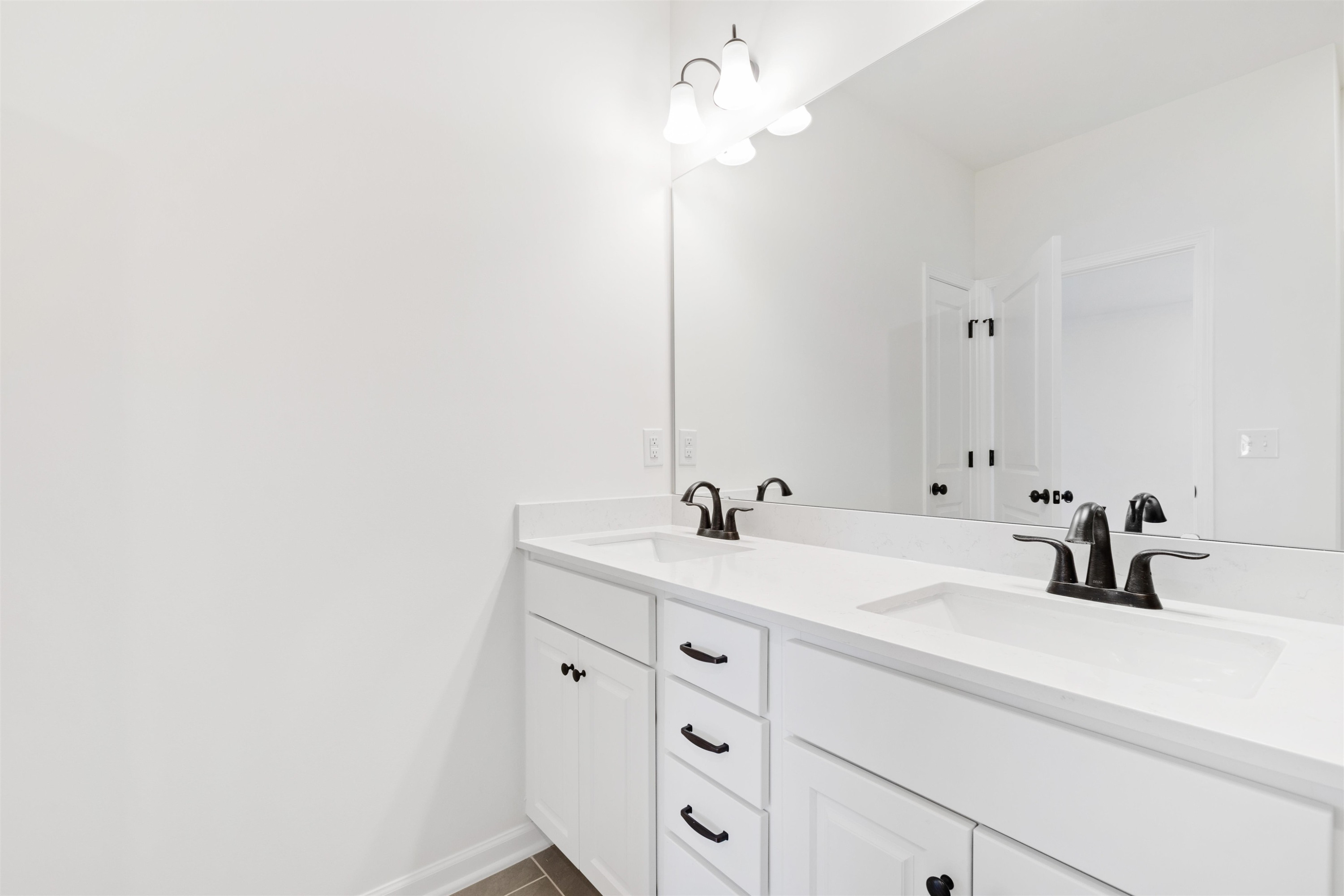 45 Cutshaw Road Youngsville, NC 27596 - Photo 37 of 49 a bathroom with a sink and a mirror