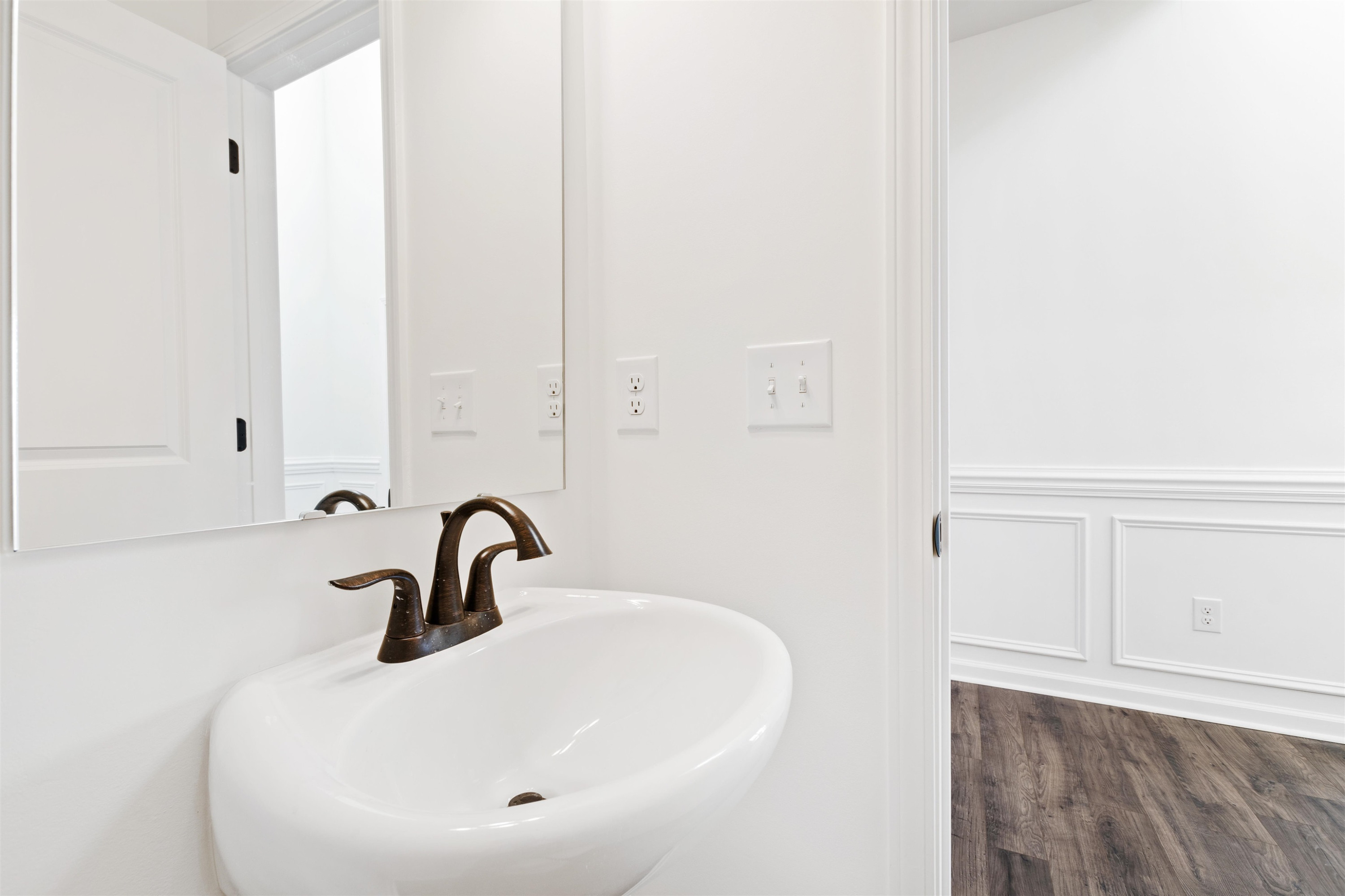 45 Cutshaw Road Youngsville, NC 27596 - Photo 39 of 49 a bathroom with a sink and mirror