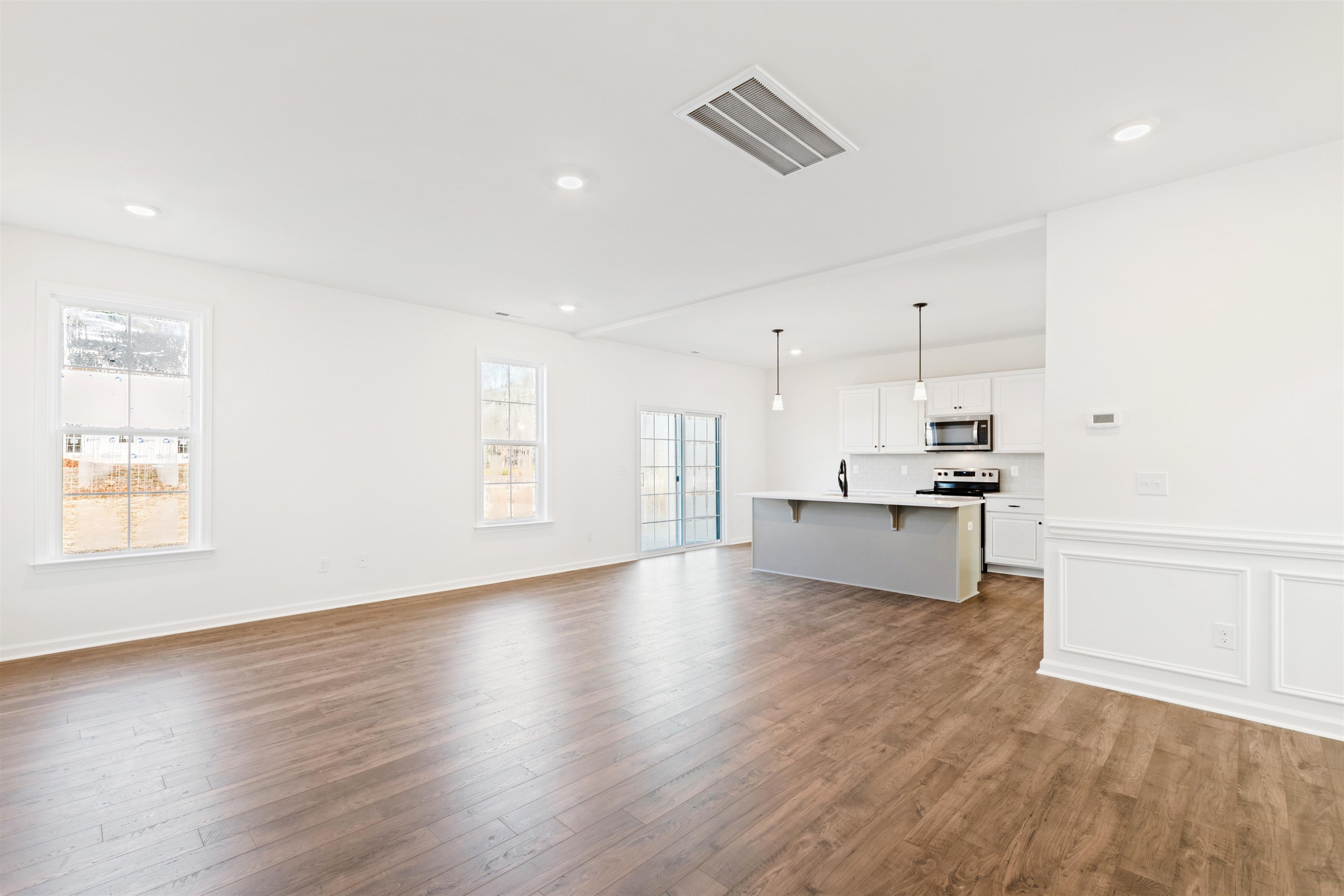 45 Cutshaw Road Youngsville, NC 27596 - Photo 8 of 49 a open kitchen with white cabinets and wooden floor