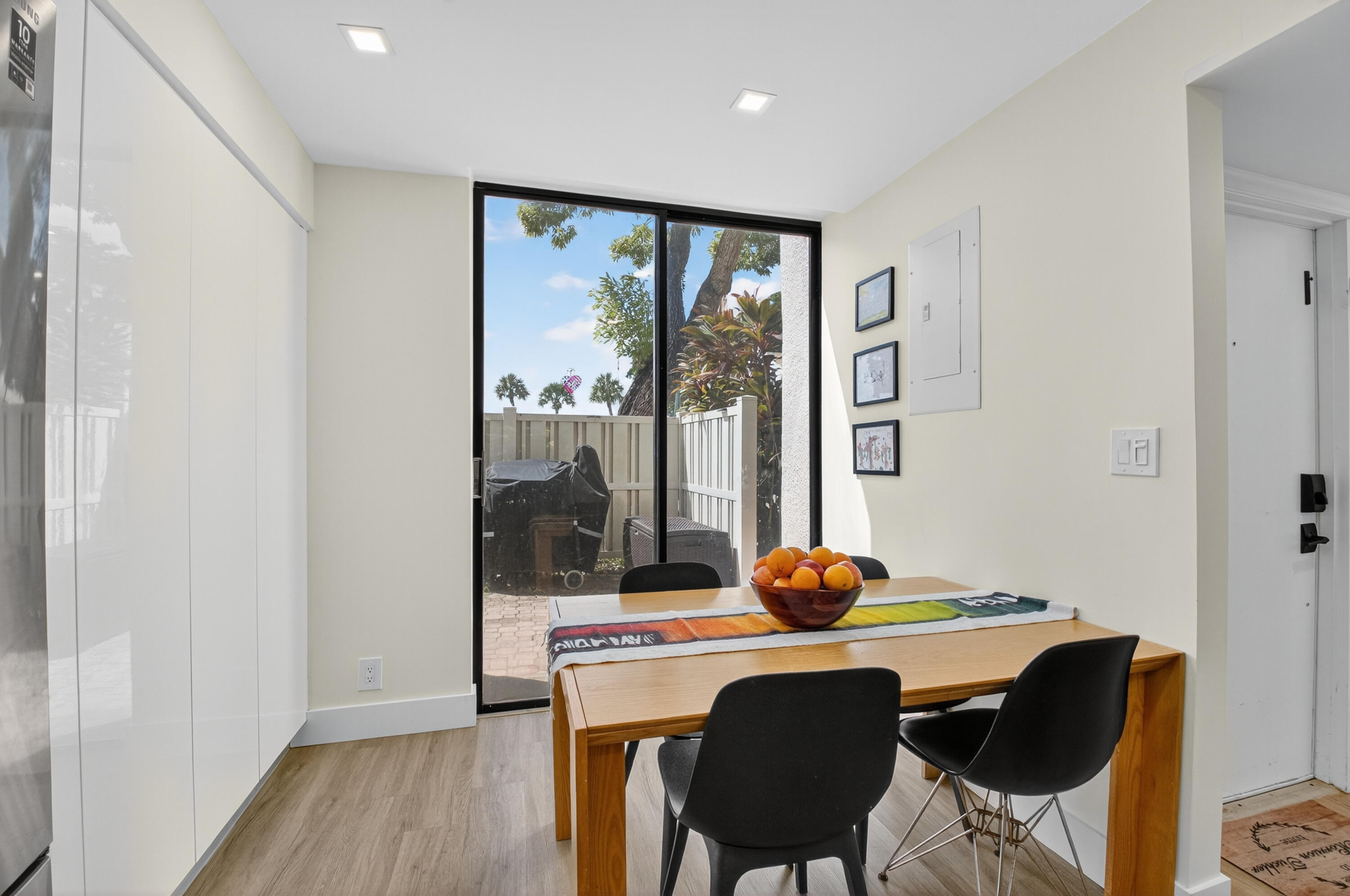 701 Bridgewood Drive Boca Raton, FL 33434 - Photo 17 of 81 a dining room with furniture and wooden floor
