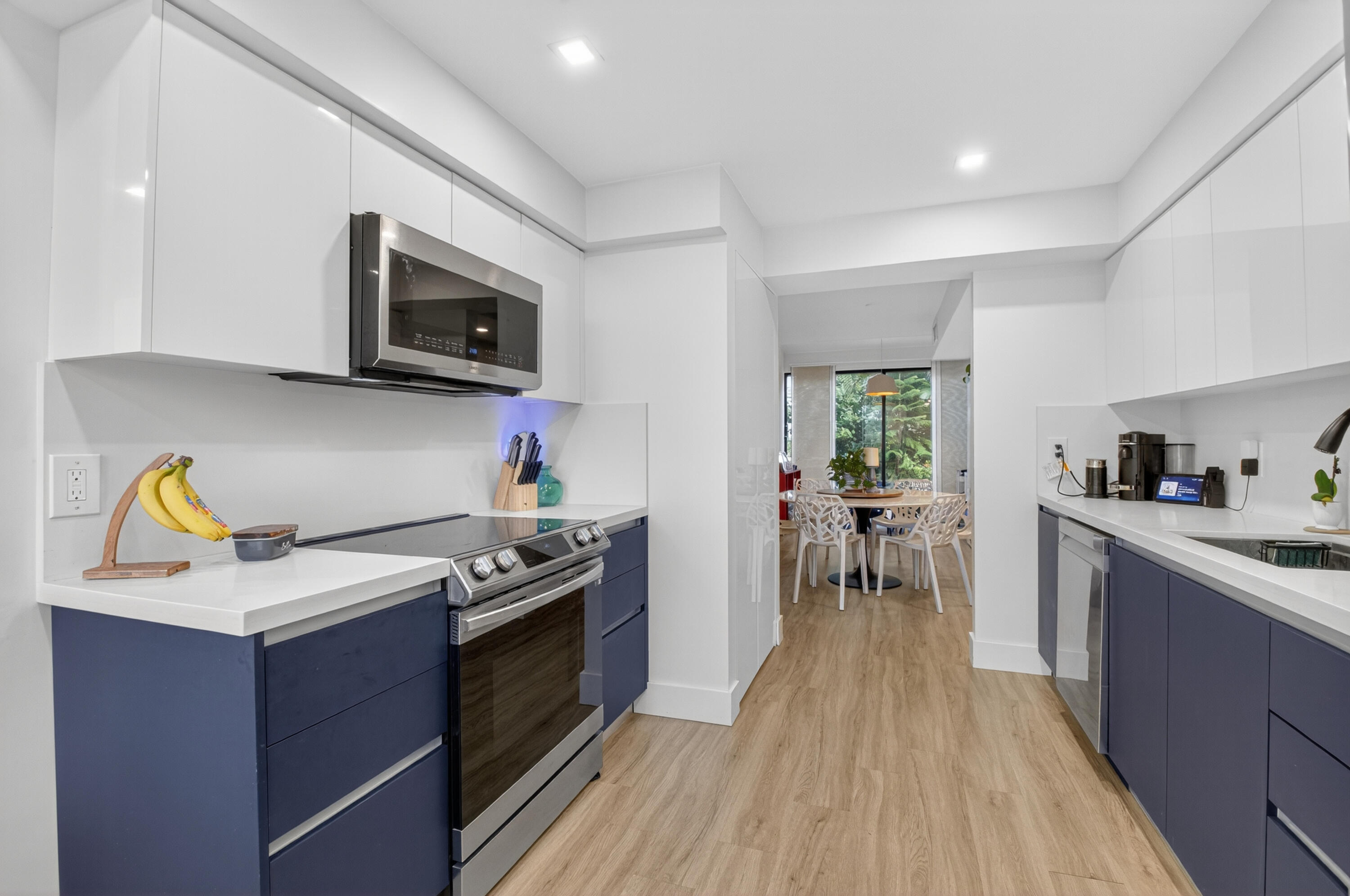 701 Bridgewood Drive Boca Raton, FL 33434 - Photo 19 of 81 a kitchen with stainless steel appliances a stove a sink and a microwave