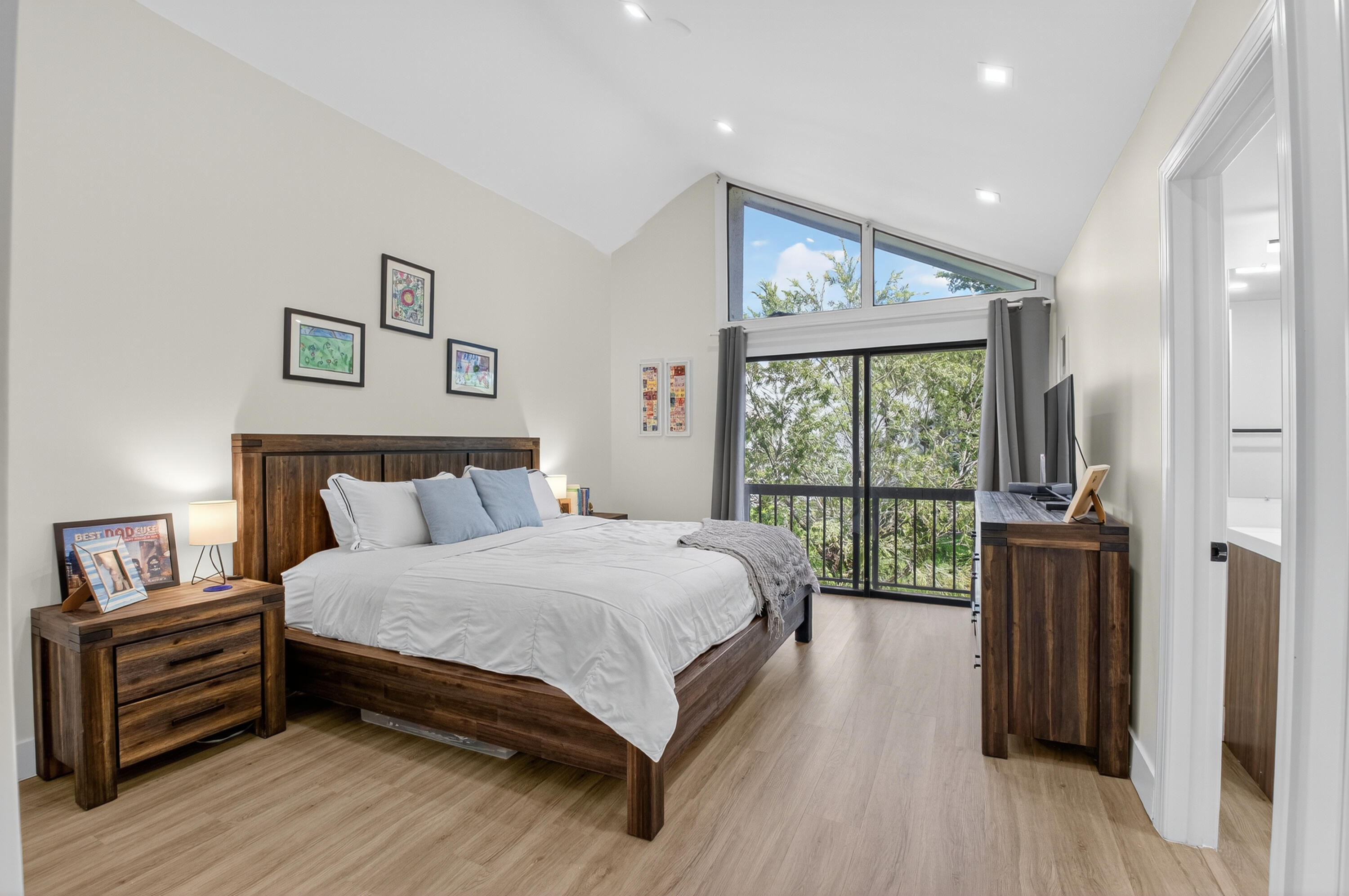 701 Bridgewood Drive Boca Raton, FL 33434 - Photo 26 of 81 a spacious bedroom with a bed and a large window