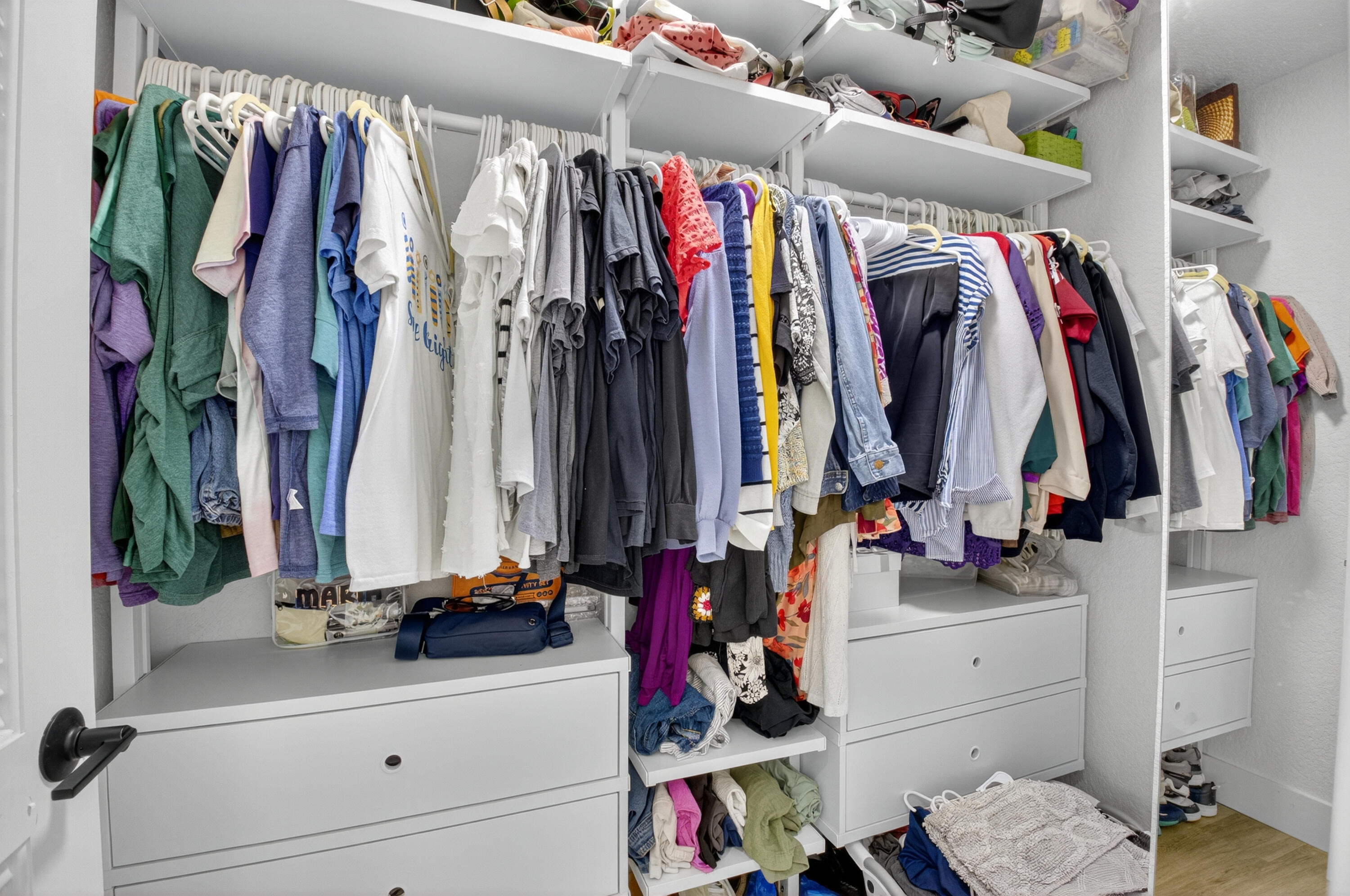701 Bridgewood Drive Boca Raton, FL 33434 - Photo 29 of 81 a view of walk in closet with clothes and shoes