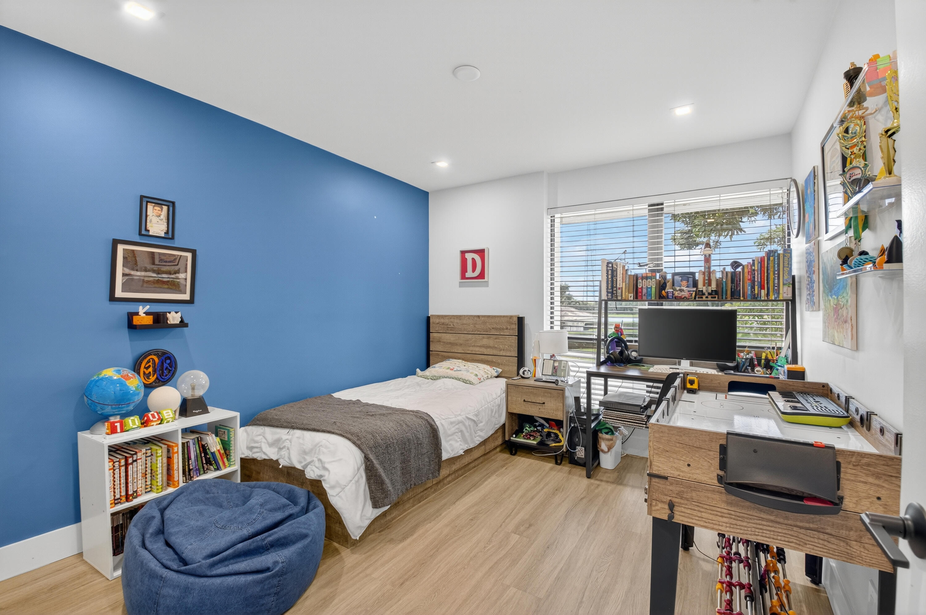 701 Bridgewood Drive Boca Raton, FL 33434 - Photo 32 of 81 a bedroom with furniture and a wooden floor