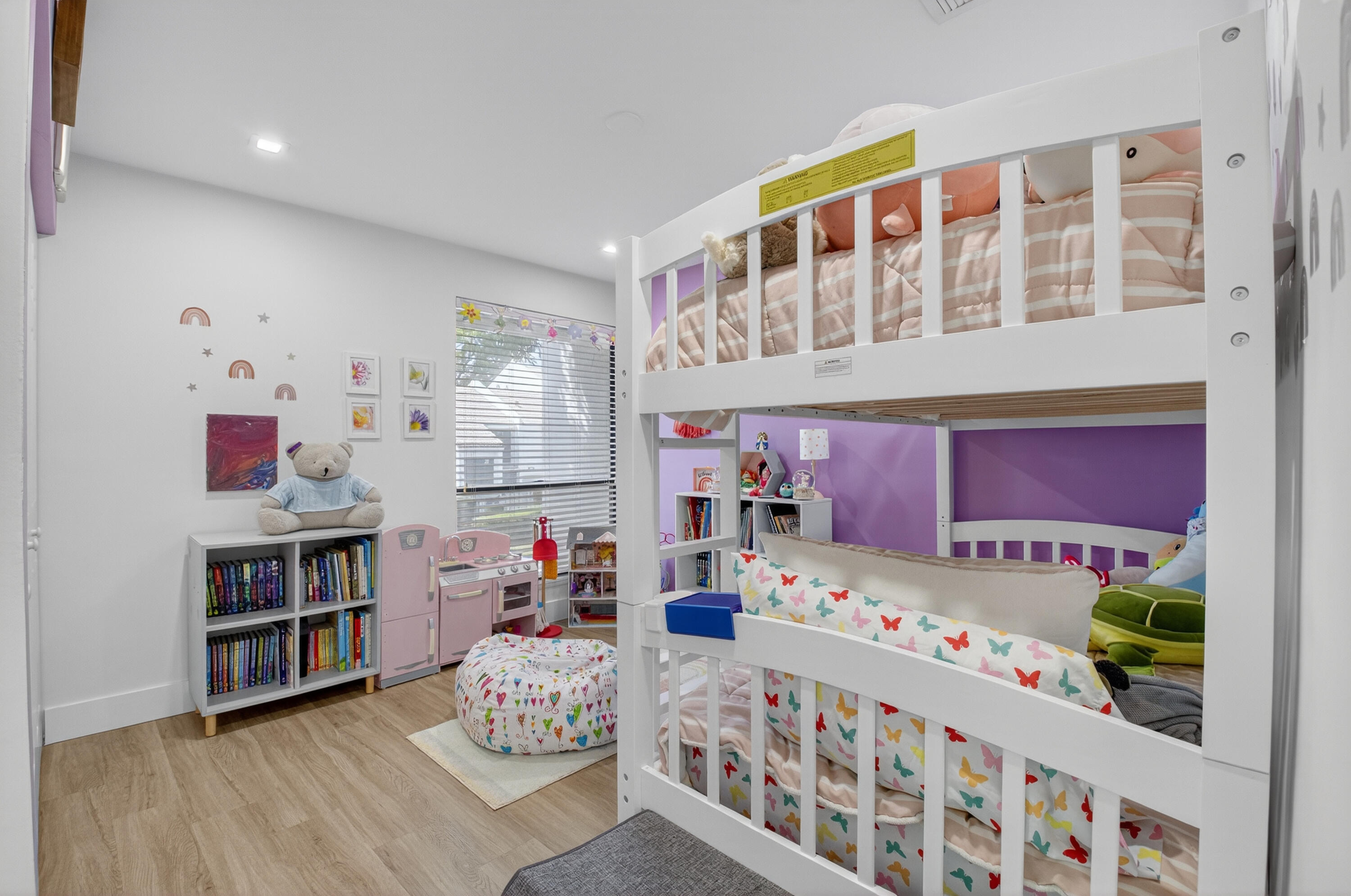 701 Bridgewood Drive Boca Raton, FL 33434 - Photo 34 of 81 a bedroom with furniture a baby crib and a wooden floor