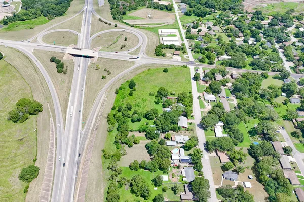 an aerial view of a residential houses with yard