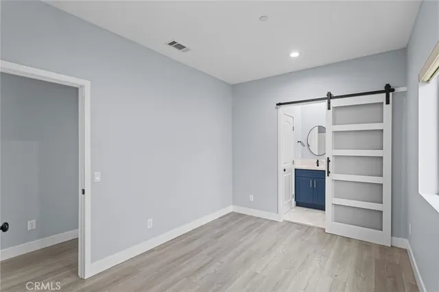 a bathroom with a sink a mirror a vanity and a shower