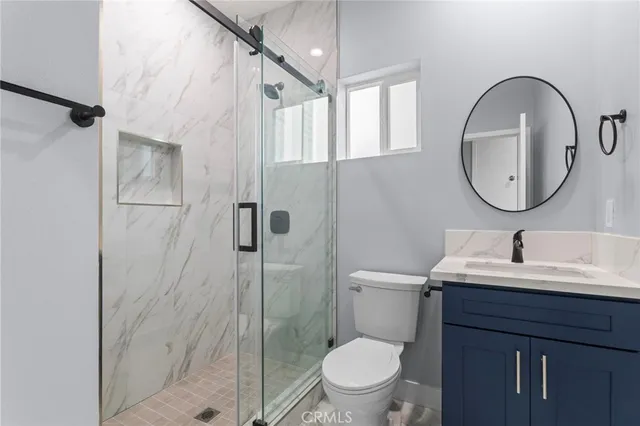 a view of a balcony with a floor to ceiling window and an outdoor space