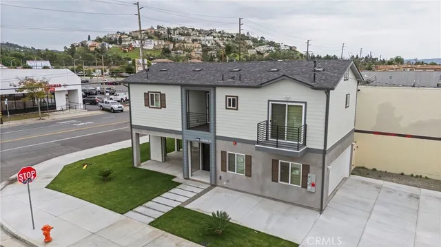 an aerial view of a city with streets and houses
