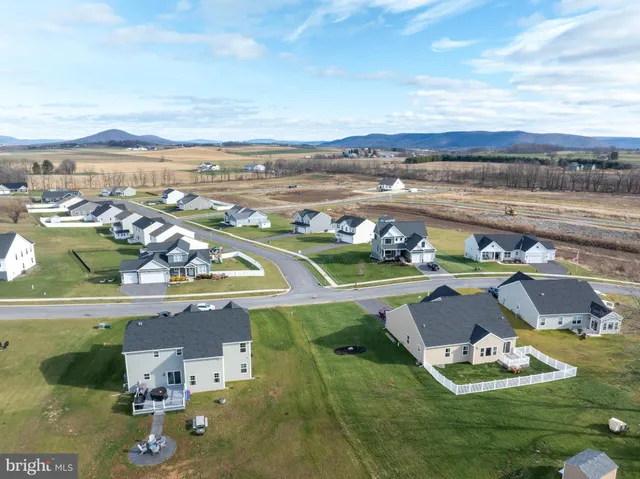 an aerial view of a house with a garden