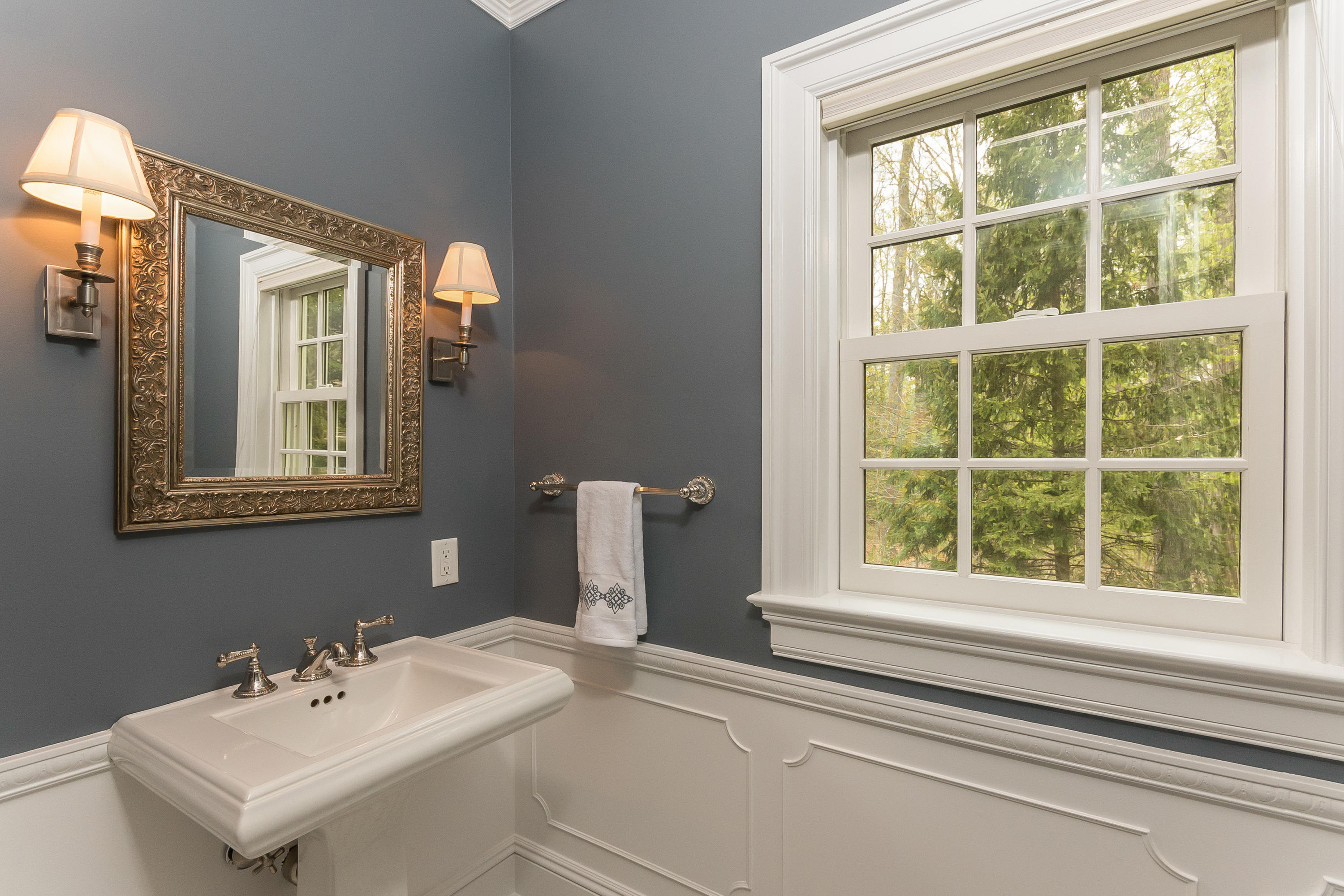 43 Stony Brook Road Darien, CT 06820 - Photo 15 of 46 a bathroom with a sink and a mirror