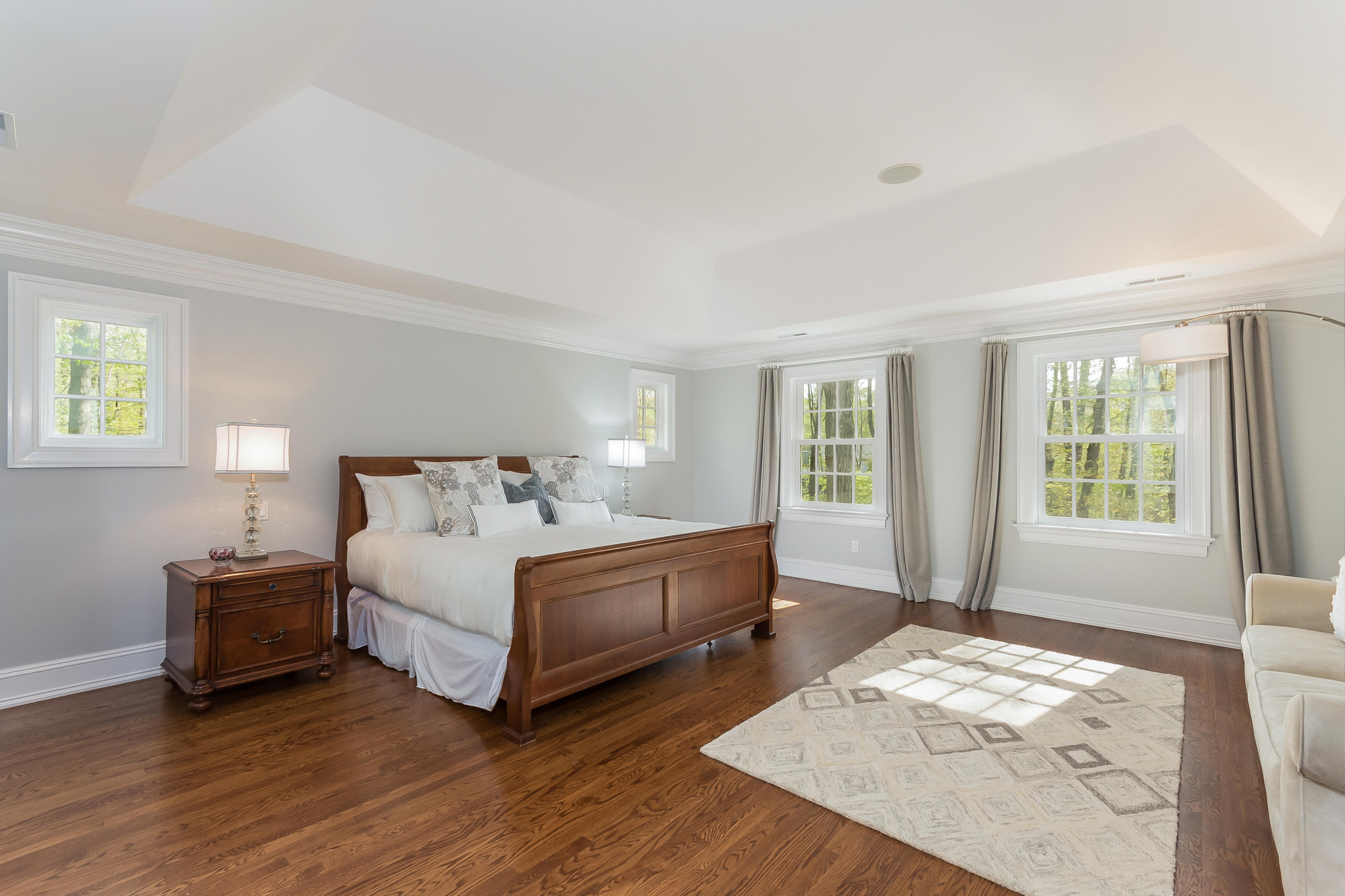 43 Stony Brook Road Darien, CT 06820 - Photo 17 of 46 a spacious bedroom with a bed and a window