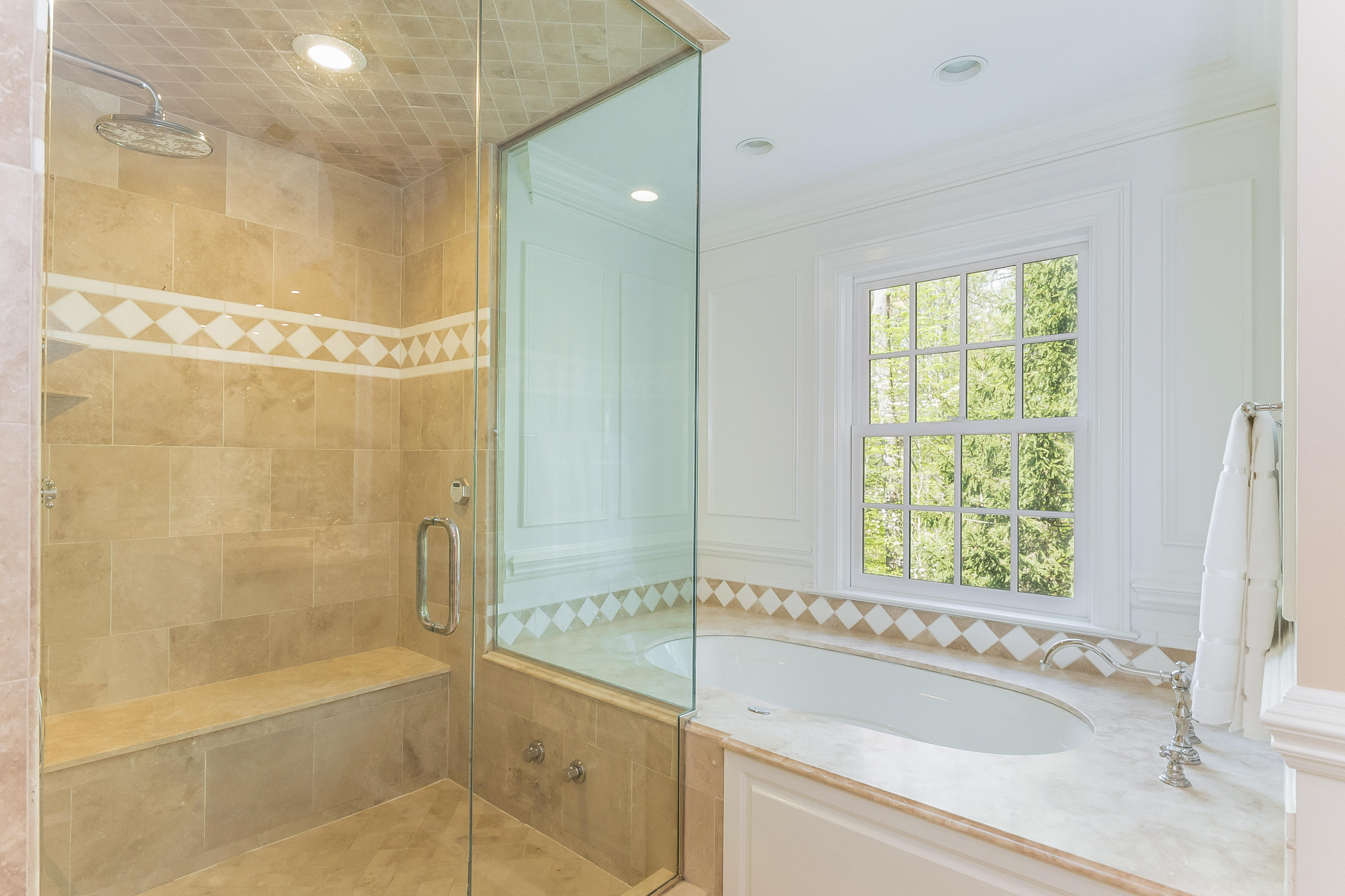 43 Stony Brook Road Darien, CT 06820 - Photo 20 of 46 a bathroom with a bathtub and a shower
