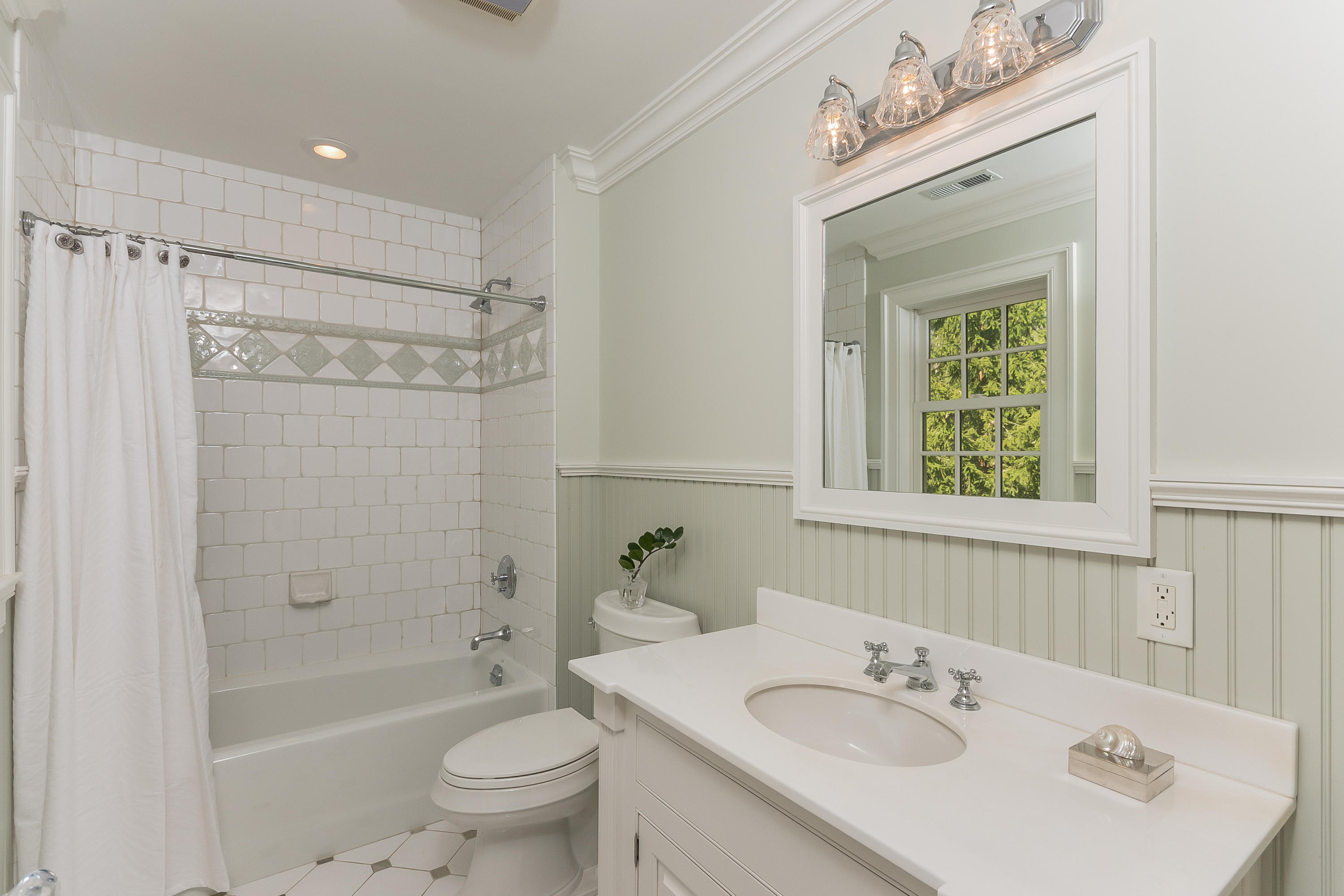 43 Stony Brook Road Darien, CT 06820 - Photo 23 of 46 a bathroom with a sink a toilet and shower