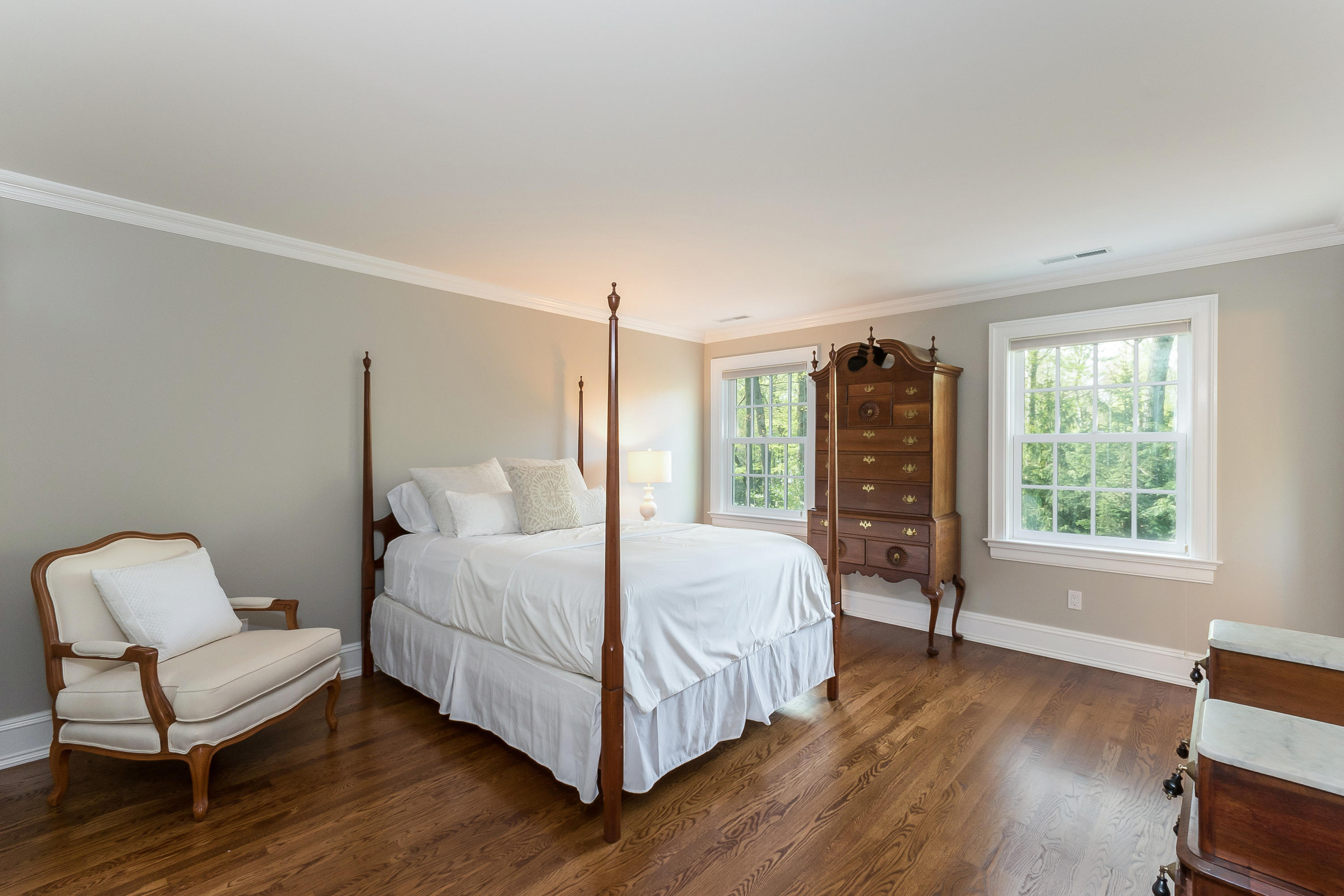 43 Stony Brook Road Darien, CT 06820 - Photo 24 of 46 a bedroom with a bed and a chair