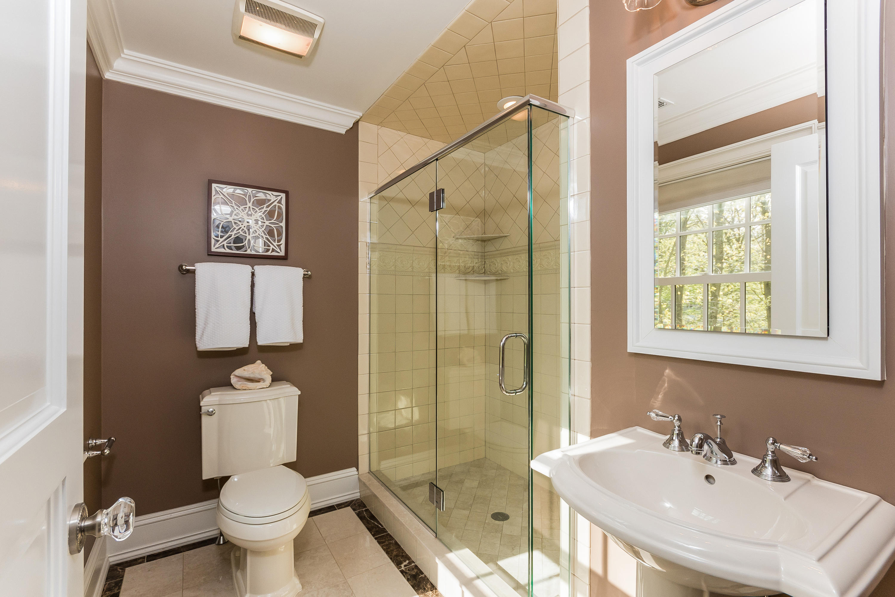 43 Stony Brook Road Darien, CT 06820 - Photo 25 of 46 a bathroom with a sink toilet and shower