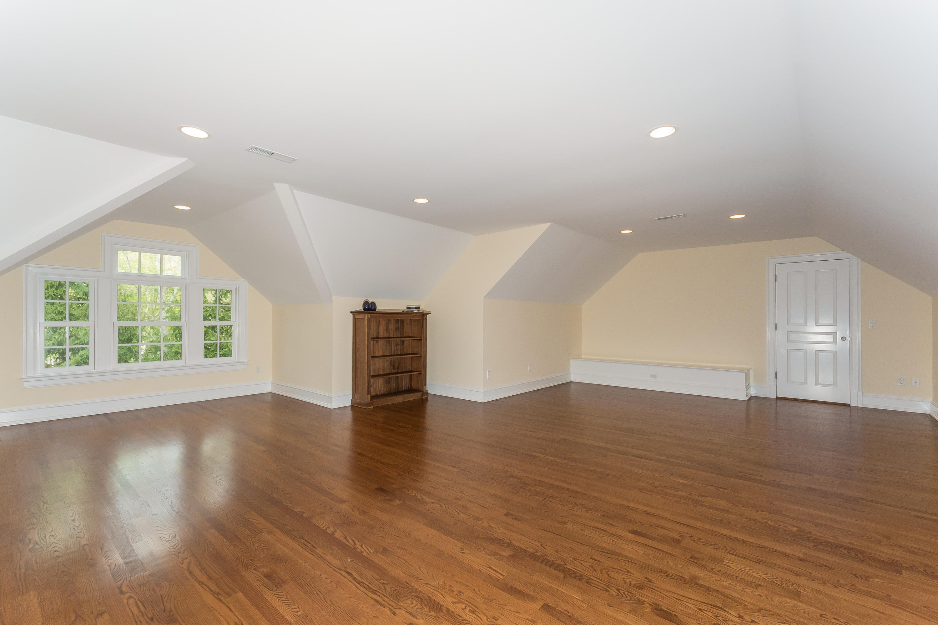 43 Stony Brook Road Darien, CT 06820 - Photo 29 of 46 an empty room with wooden floor and windows