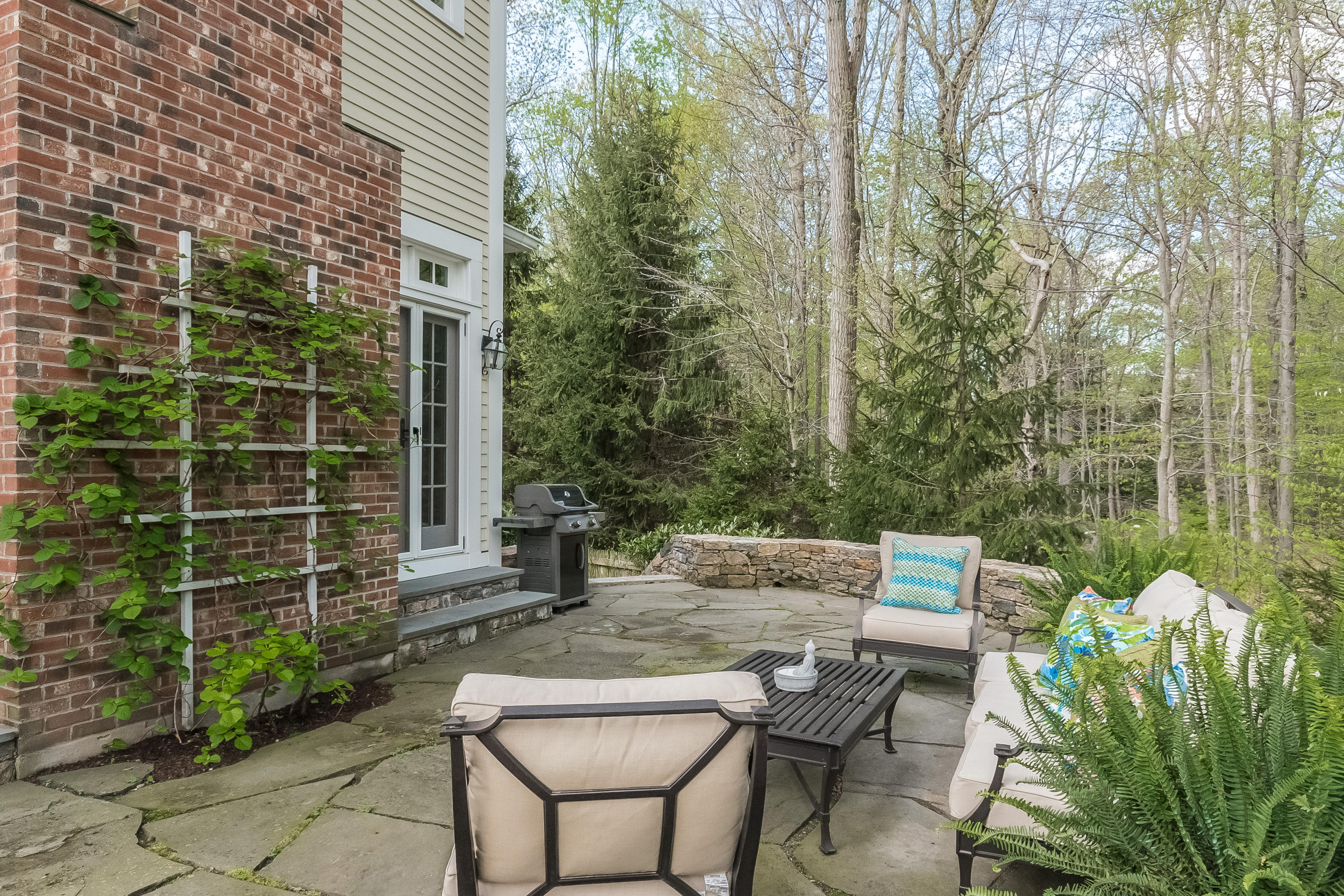 43 Stony Brook Road Darien, CT 06820 - Photo 35 of 46 a backyard of a house with outdoor seating