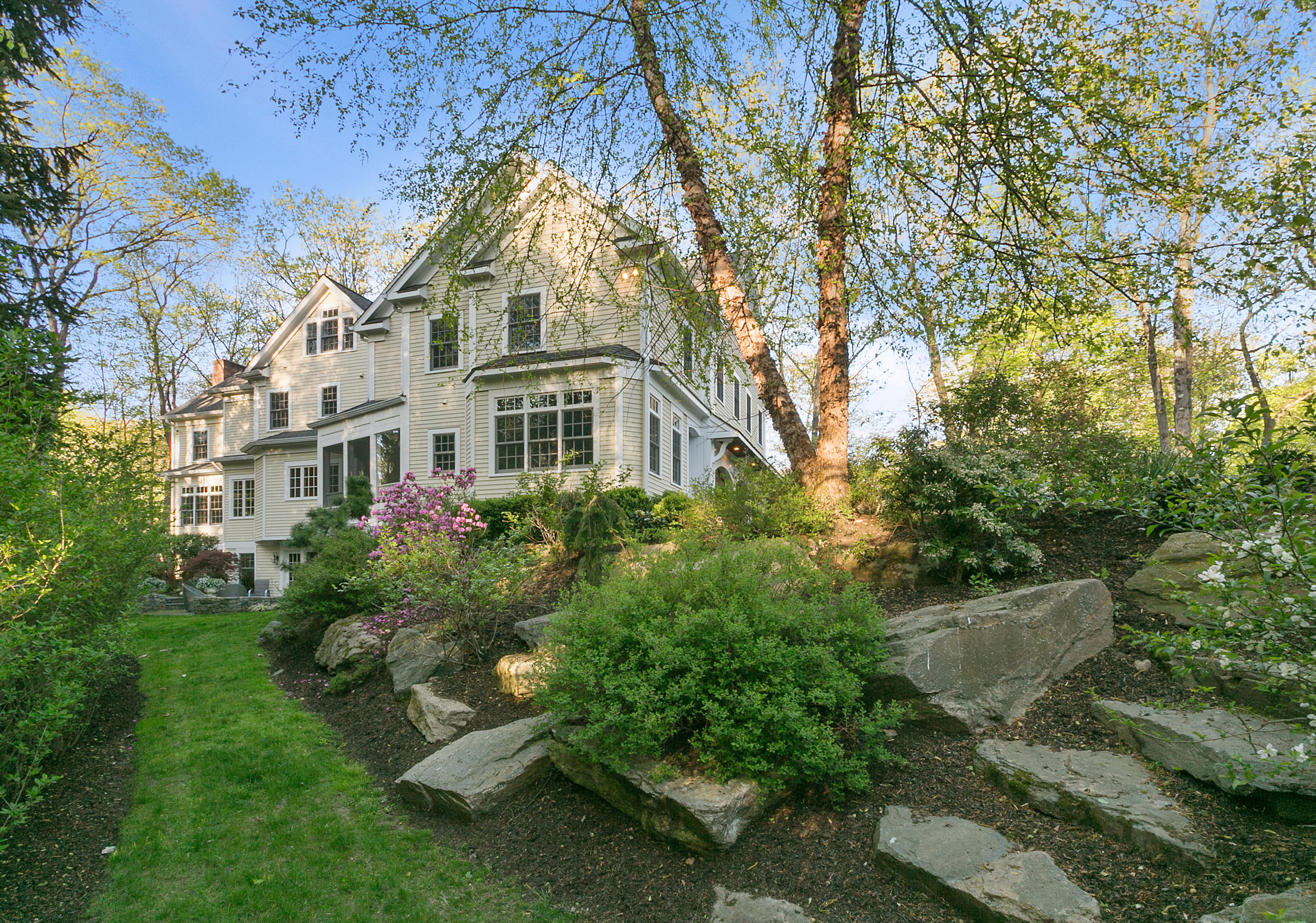 43 Stony Brook Road Darien, CT 06820 - Photo 36 of 46 a backyard of a house with plants and large trees