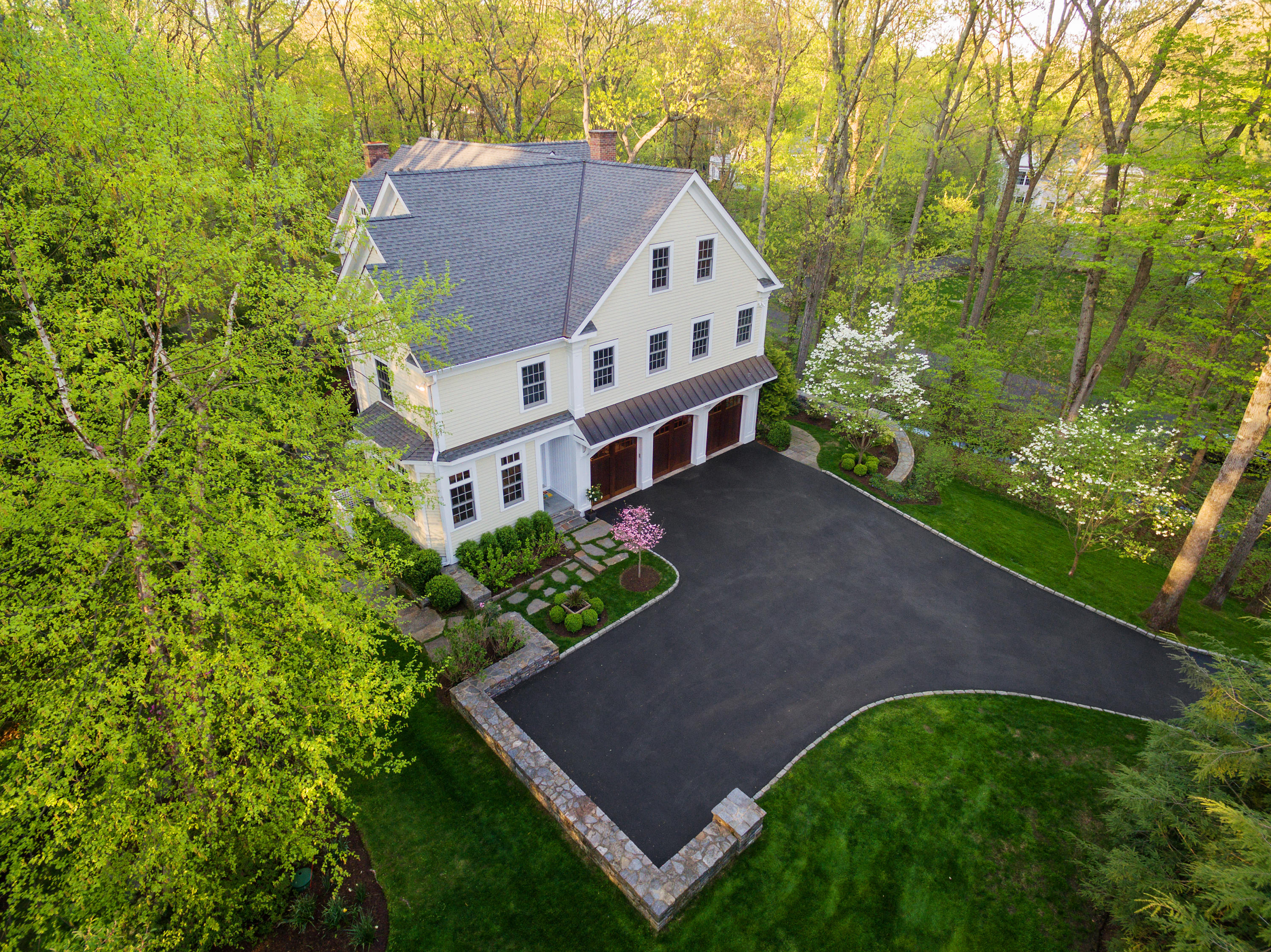 43 Stony Brook Road Darien, CT 06820 - Photo 39 of 46 a view of a house with a yard and potted plants