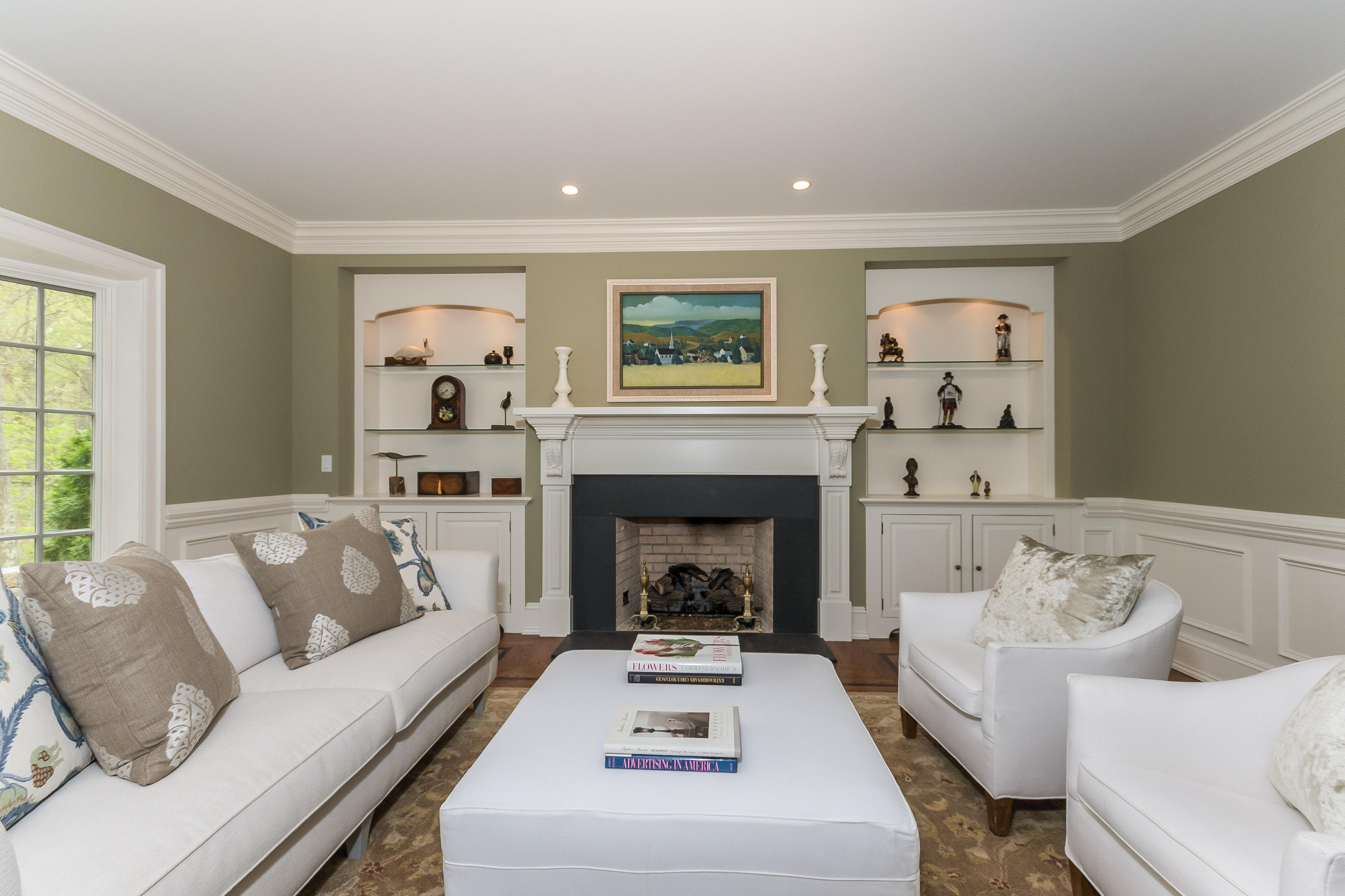 43 Stony Brook Road Darien, CT 06820 - Photo 5 of 46 a living room with furniture and a fireplace