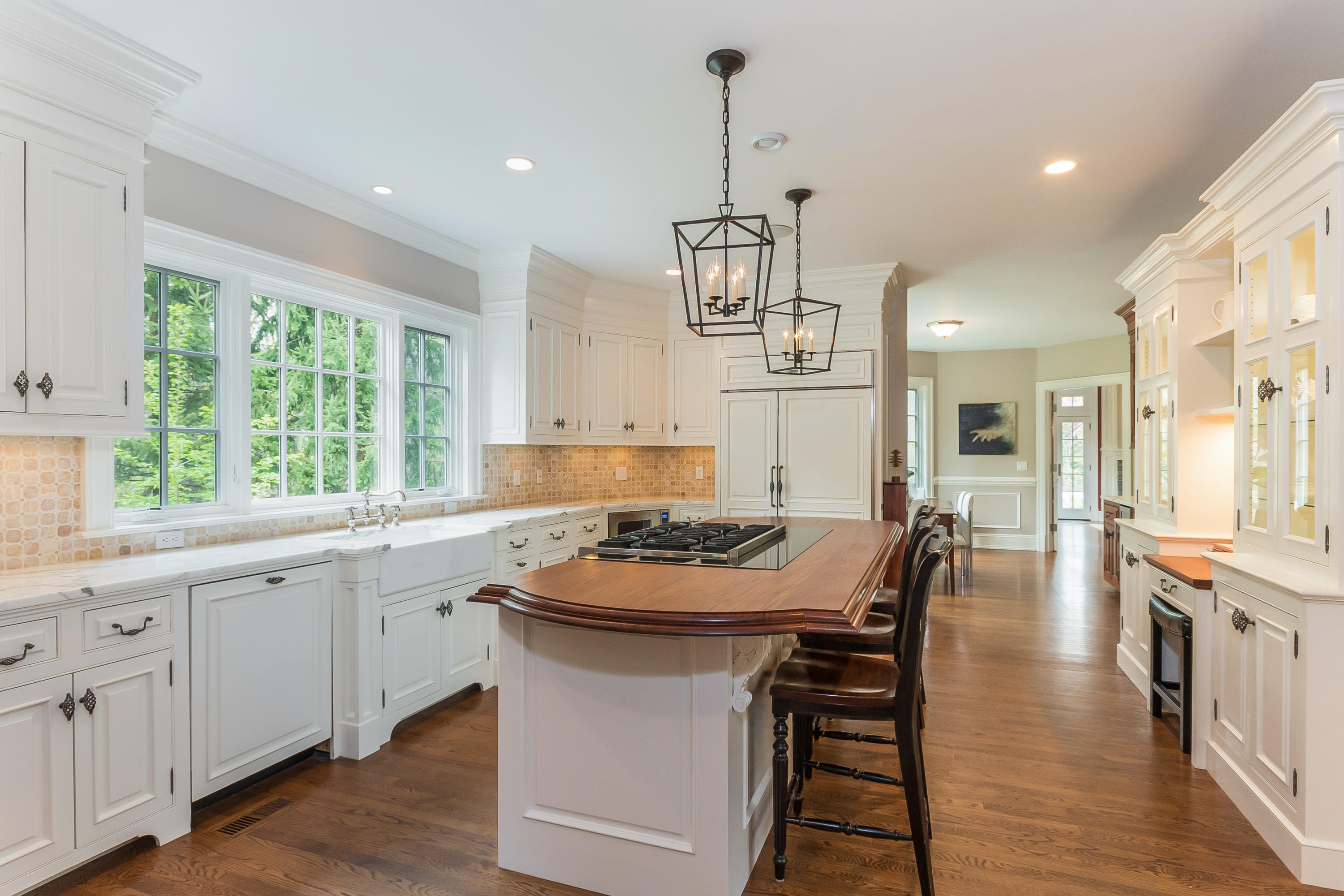43 Stony Brook Road Darien, CT 06820 - Photo 7 of 46 an open kitchen with a sink stove and wooden floor