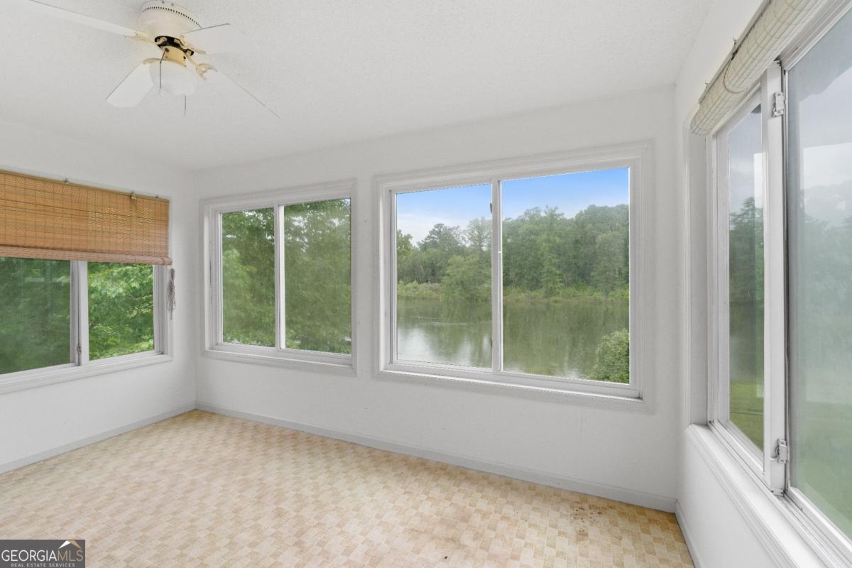394 Hunter Road Griffin, GA 30224 - Photo 17 of 38 a view of an empty room with a window
