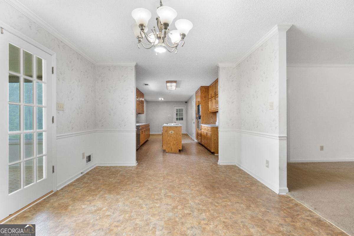 394 Hunter Road Griffin, GA 30224 - Photo 18 of 38 a view of a livingroom with a chandelier