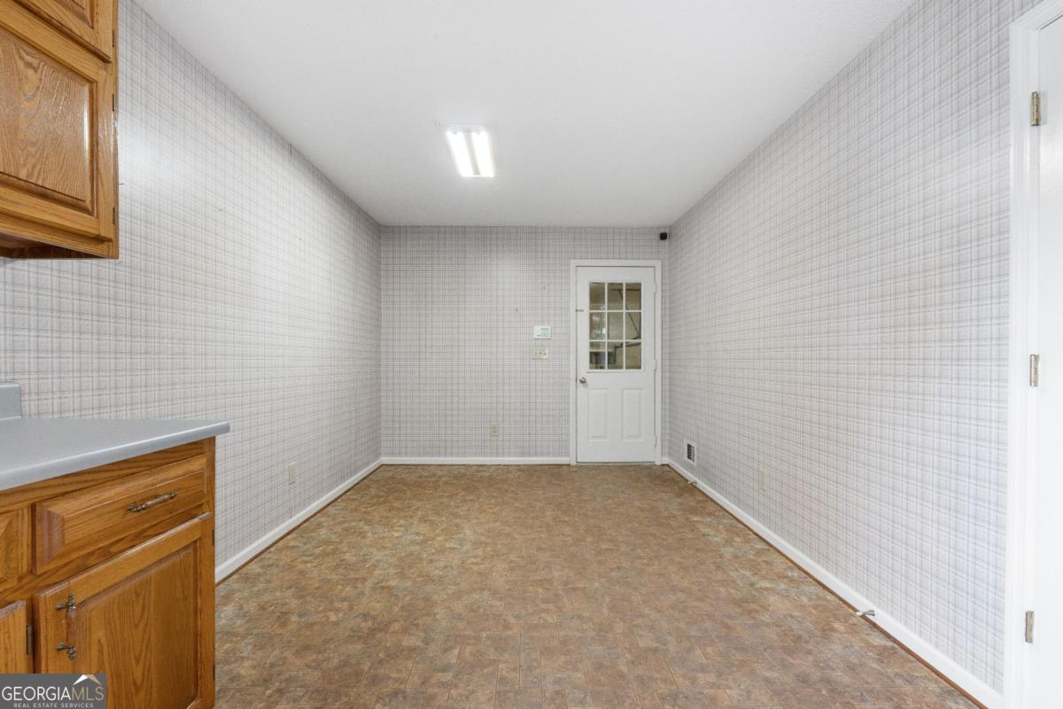 394 Hunter Road Griffin, GA 30224 - Photo 23 of 38 a view of an empty room with a window