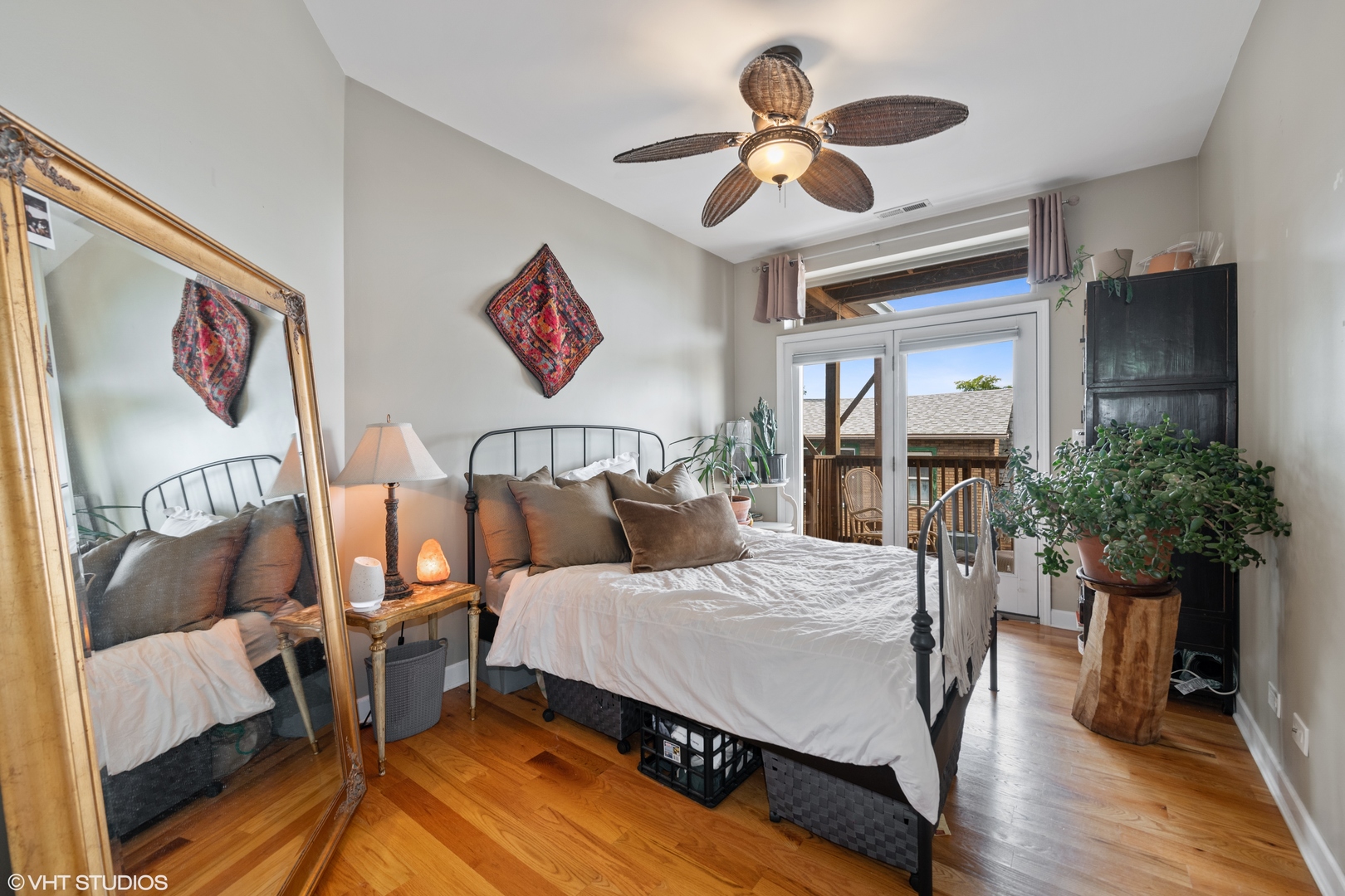 2108 North Spaulding Avenue, Unit 4 Chicago, IL 60647 - Photo 5 of 10 a bedroom with a bed and a chandelier