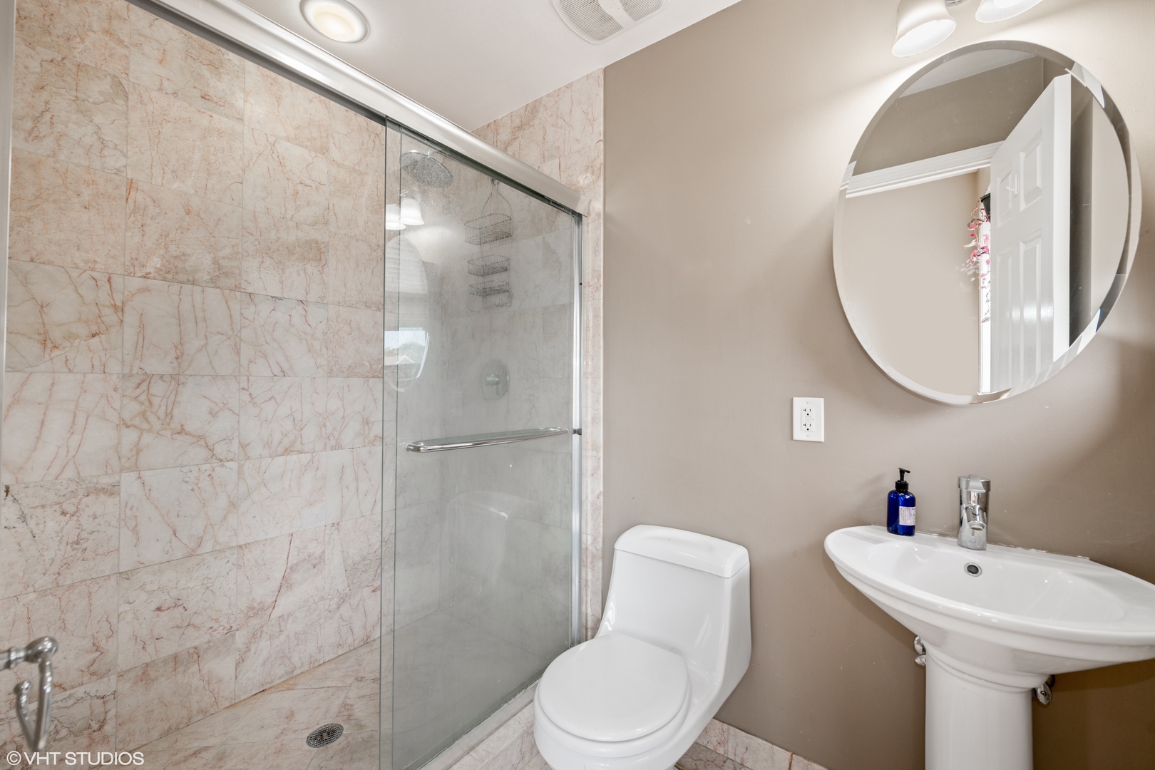 2108 North Spaulding Avenue, Unit 4 Chicago, IL 60647 - Photo 8 of 10 a bathroom with a toilet sink and a mirror