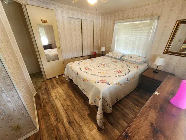 a bedroom with a bed and window